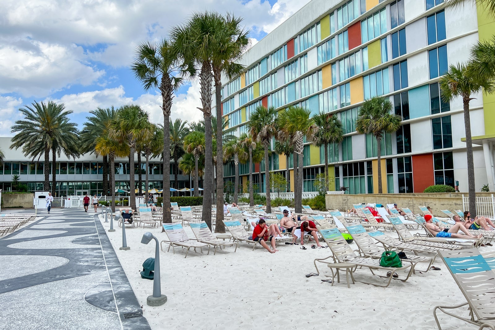 Beach chairs on sand at one of the hotel's pools.