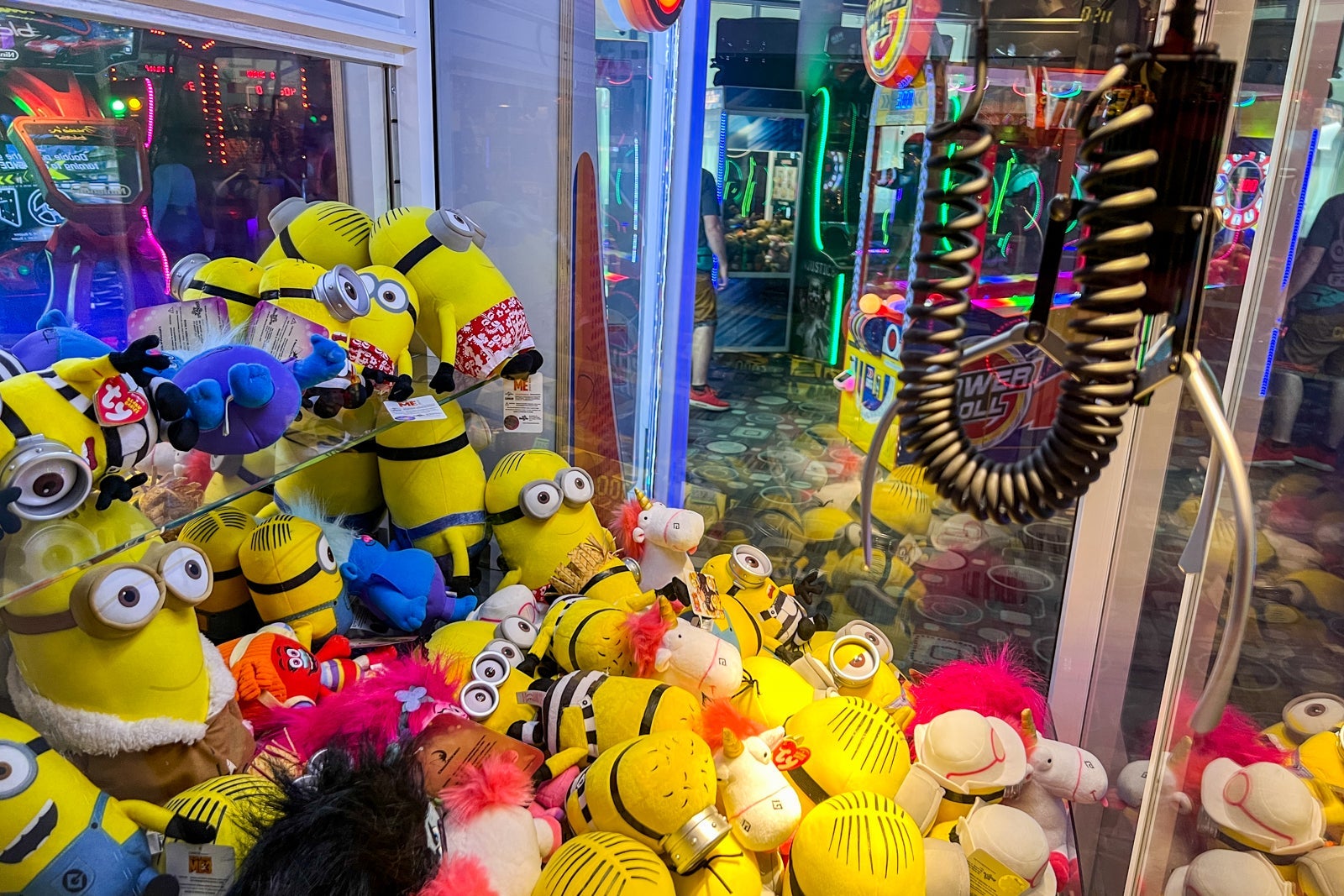 A crane game full of Minion dolls as prizes.