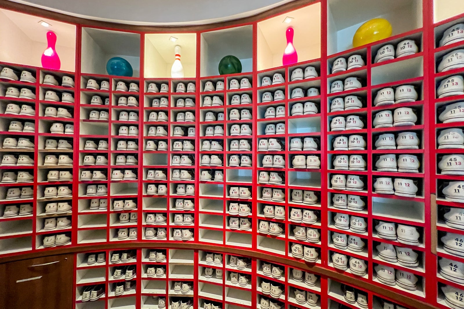 Rows and rows of bowling shoes for rent.