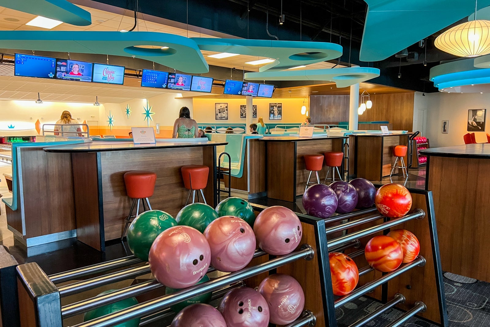 A row of bowling balls inside the hotel's bowling alley.