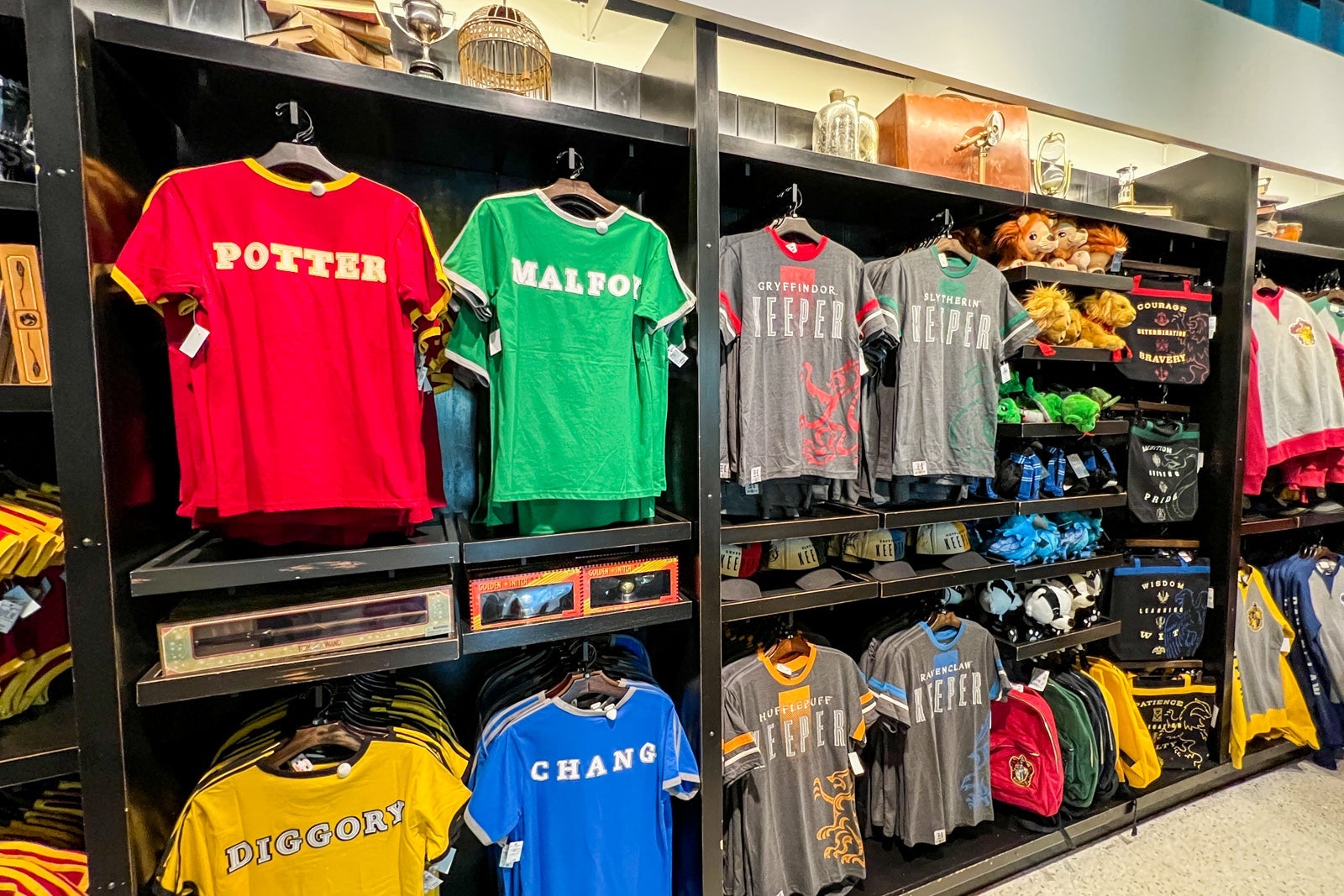 A wall full of Harry Pottery shirts.