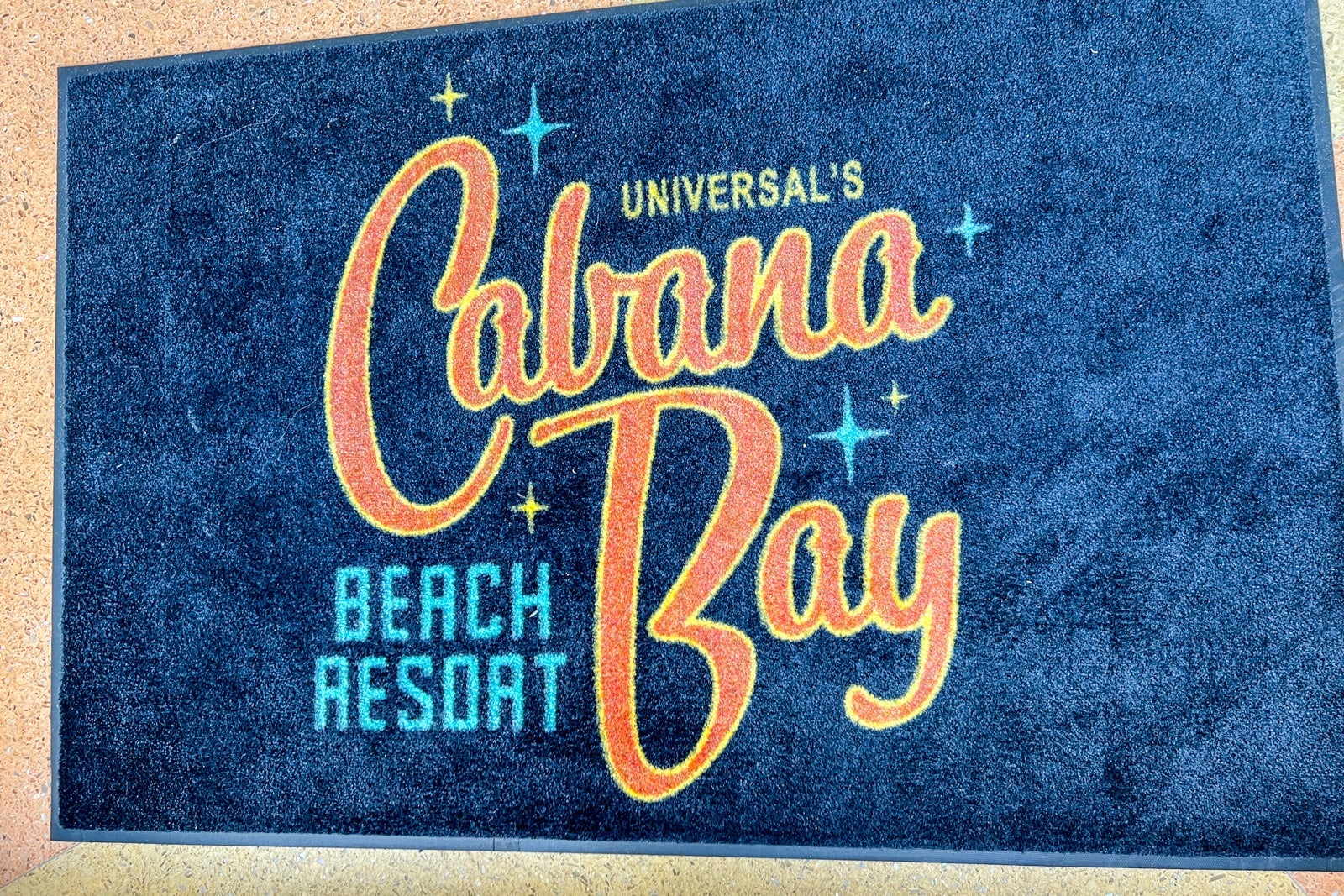 A welcome mat to Universal's Cabana Bay Beach Resort.