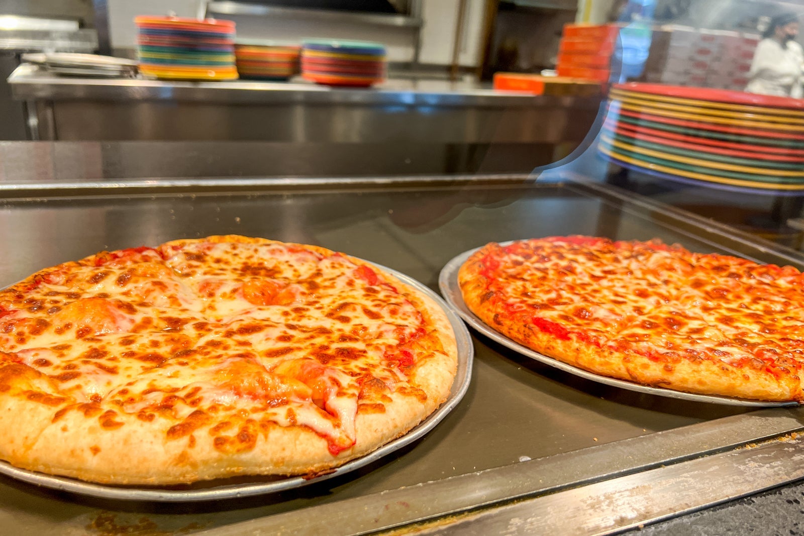 Two hot pizzas at the cafeteria.