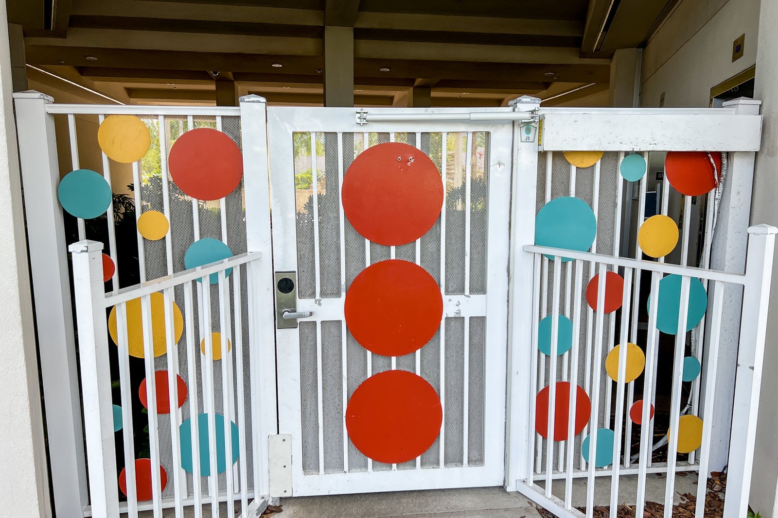 A gate from the parking lot to the hotel.