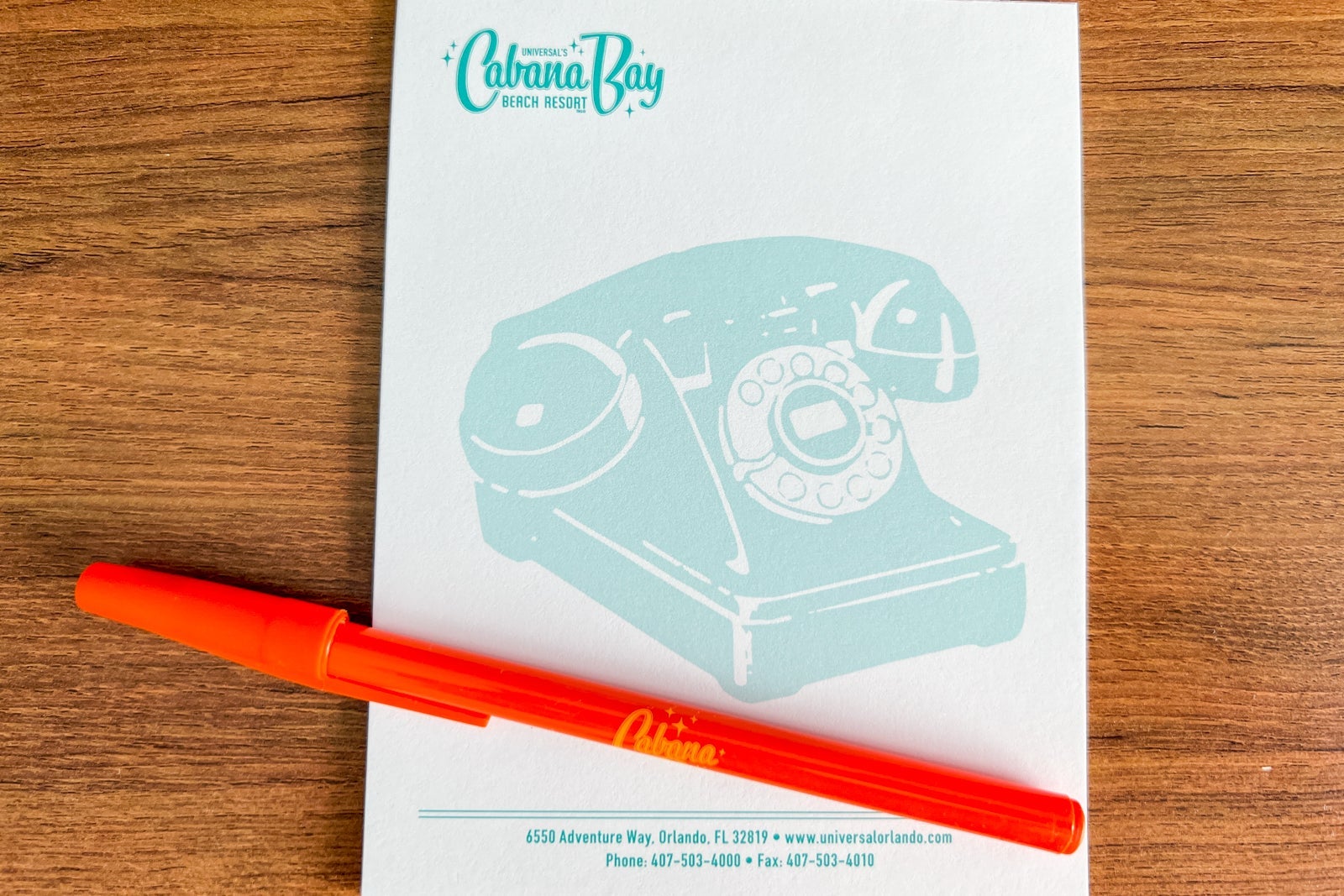 Themed hotel notepad and pen.