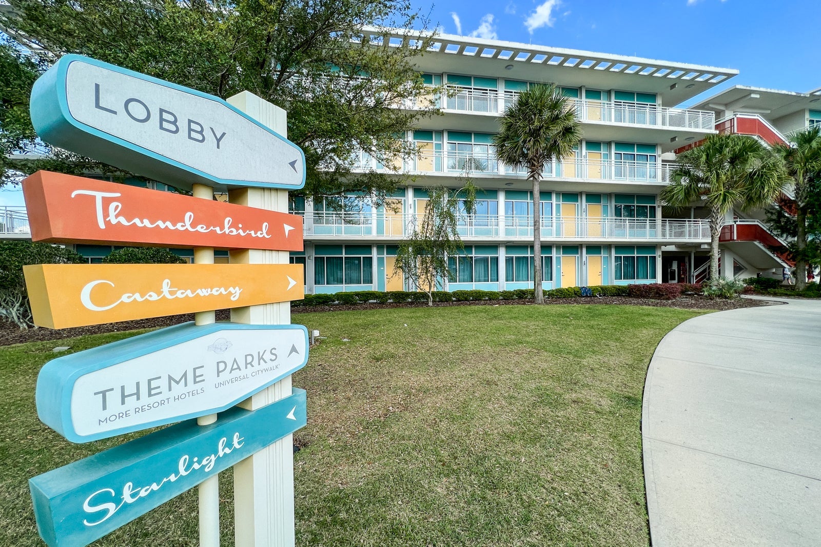 Signs pointing to various parts of Universal's Cabana Bay Beach Resor.