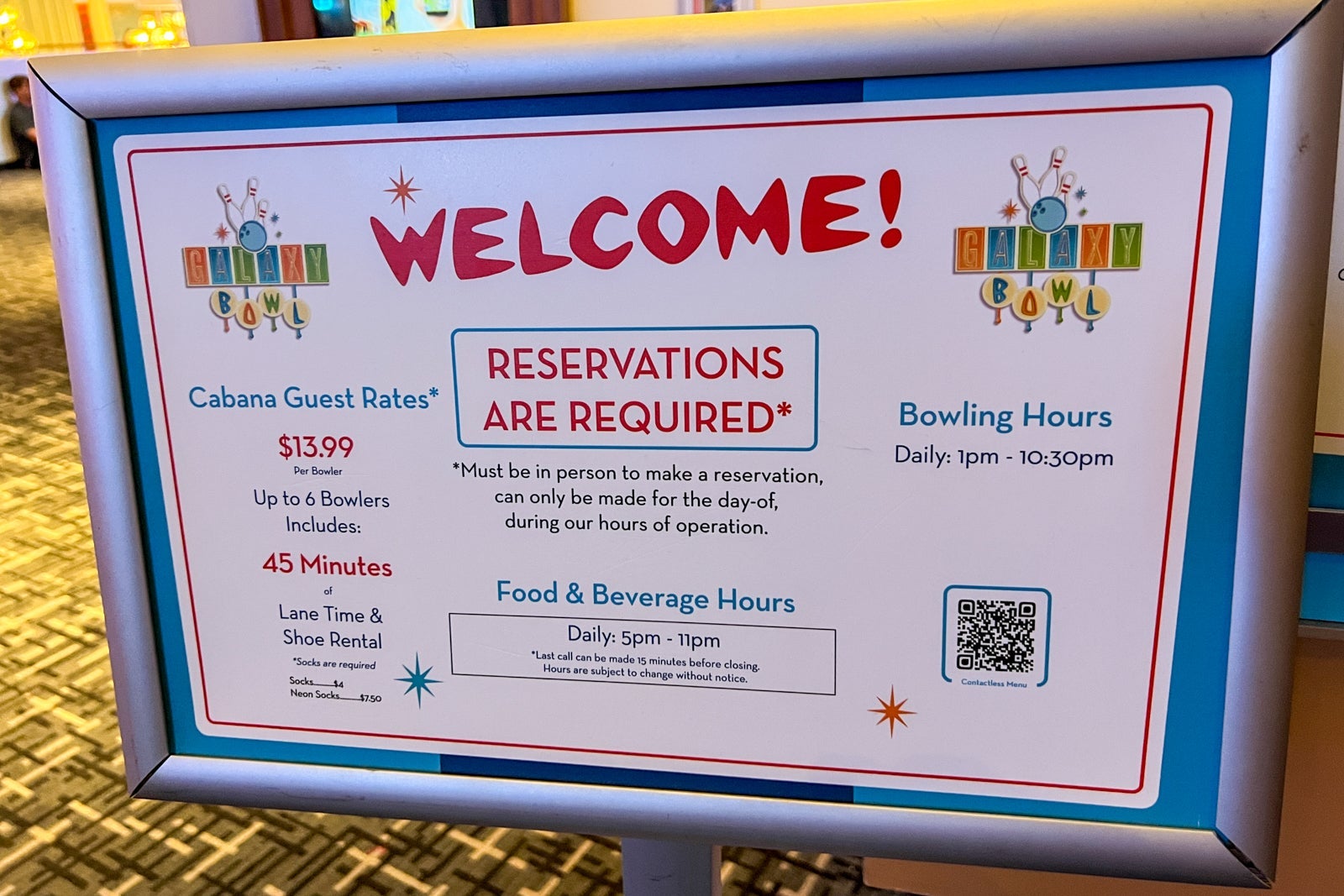 A sign welcoming people to the bowling alley.