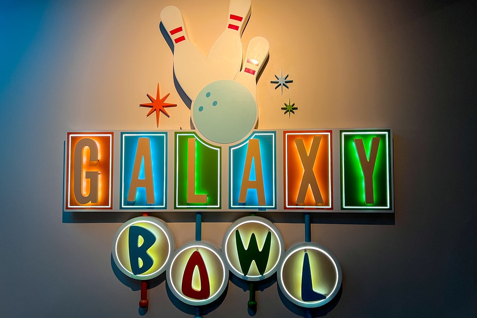 A retro sign saying Galaxy Bowl in the hotel's bowling alley.