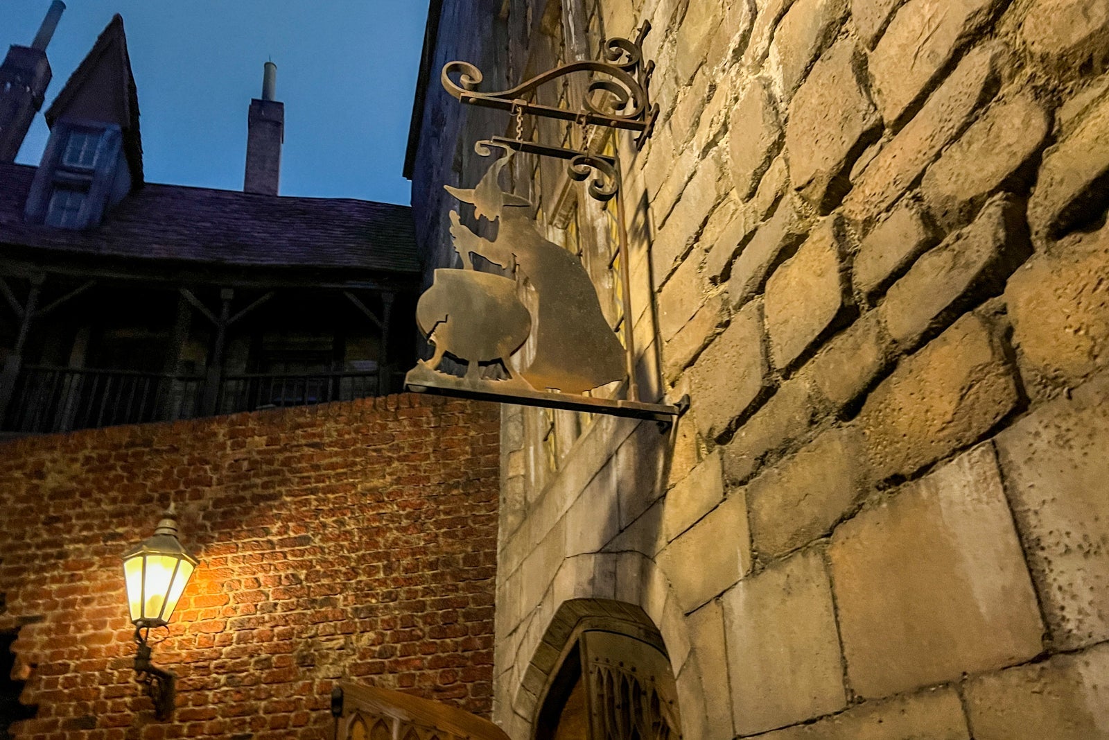 Wrought iron sign outside a brick building
