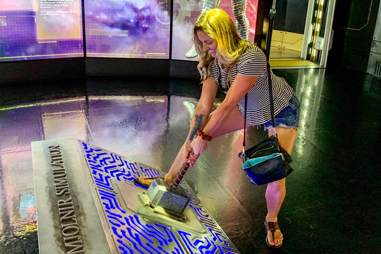Guest trying to wield Thor's hammer at Marvel Avengers Station in Las Vegas