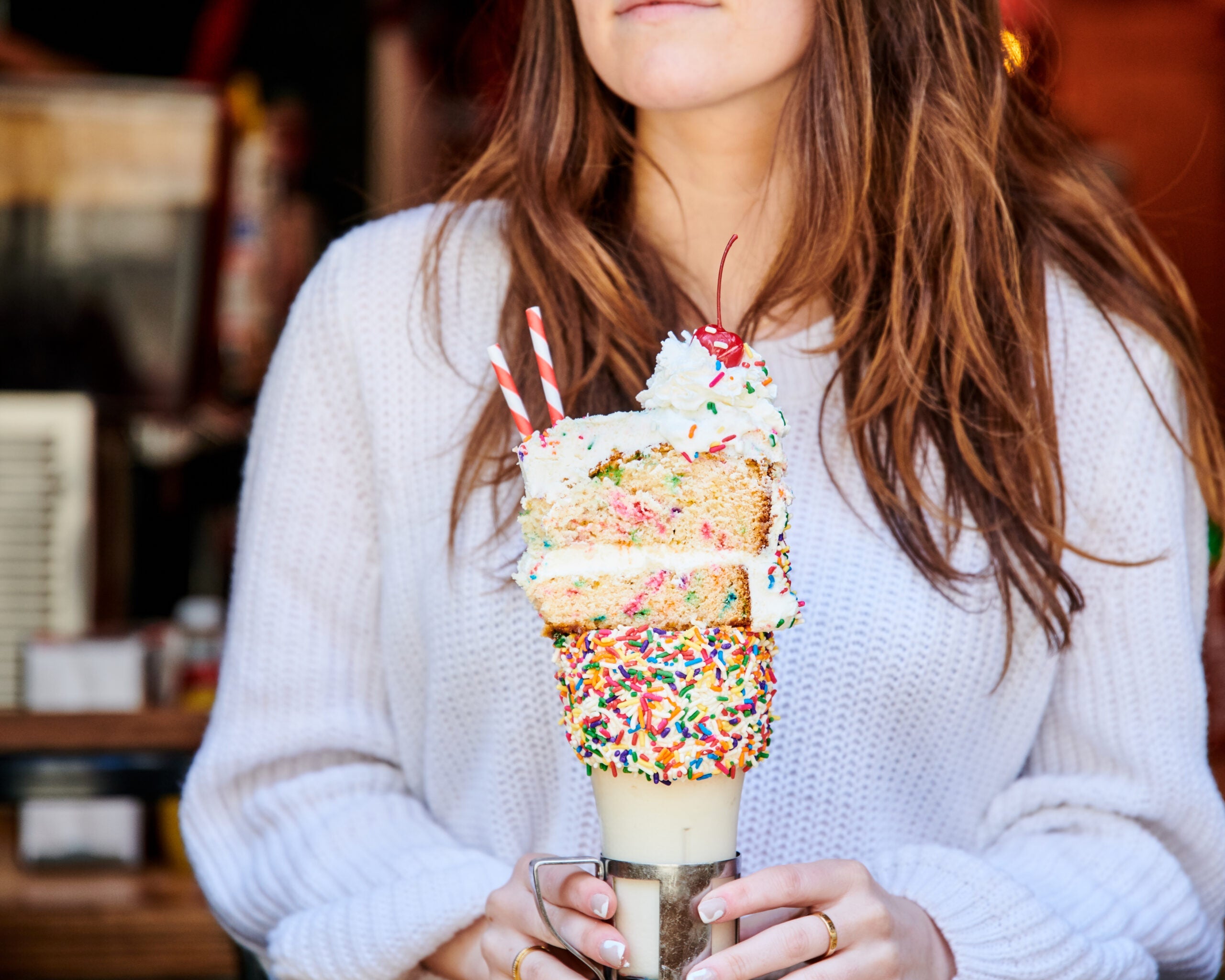 Woman holding milkshake