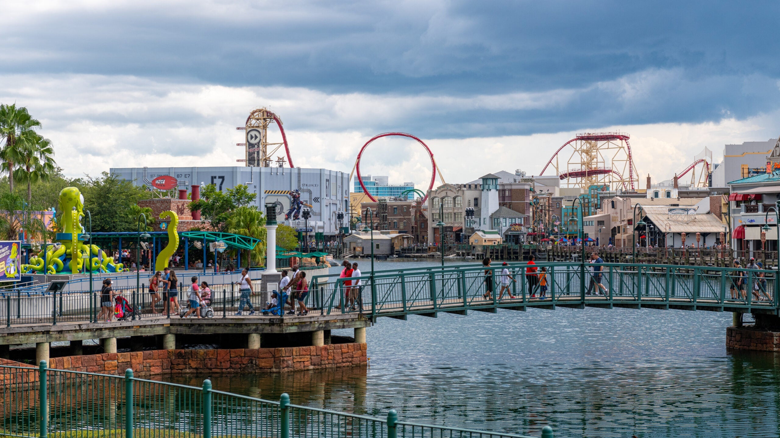 Pedestrian bridge with an amusement park in the background