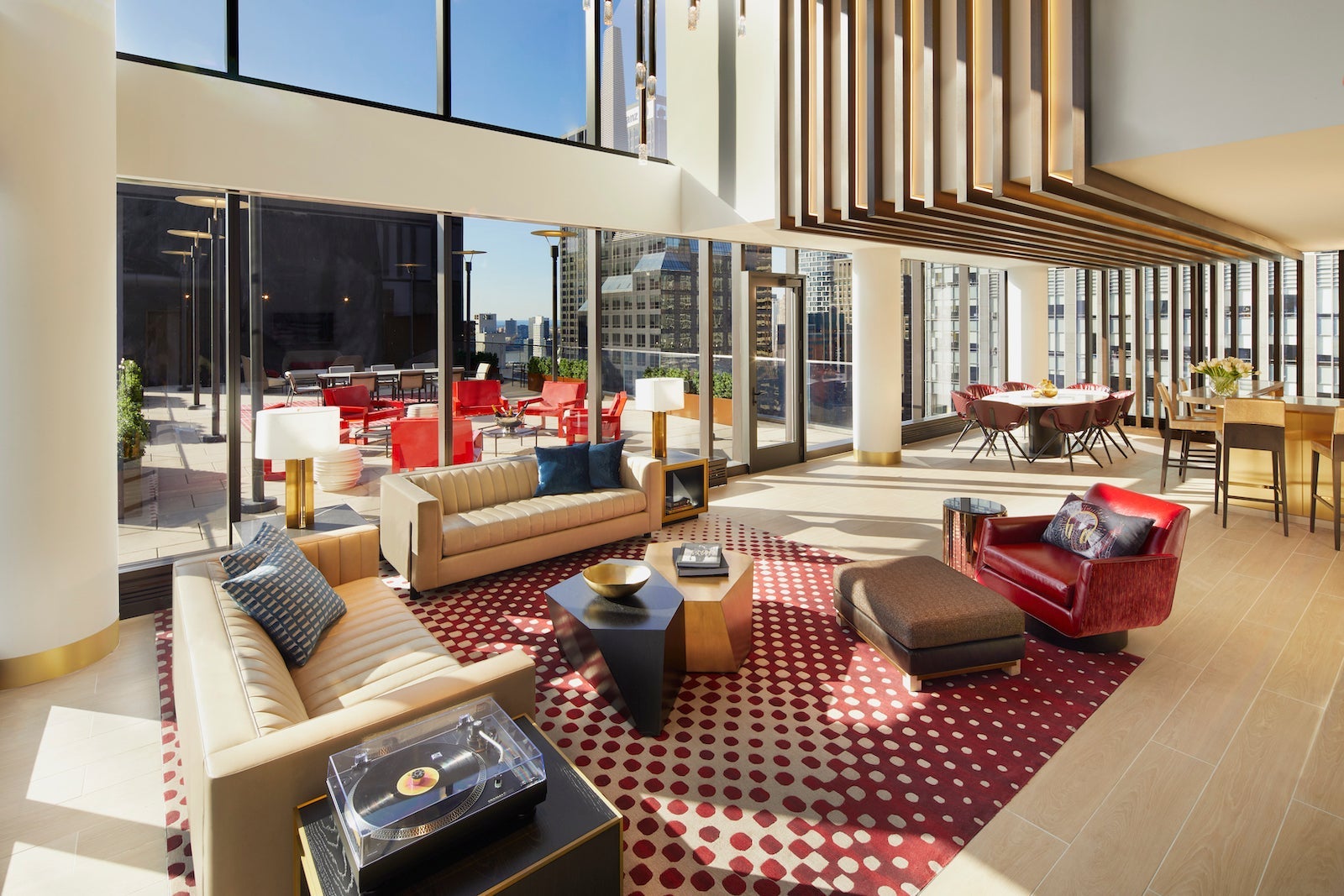 hotel suite with couch and large deck