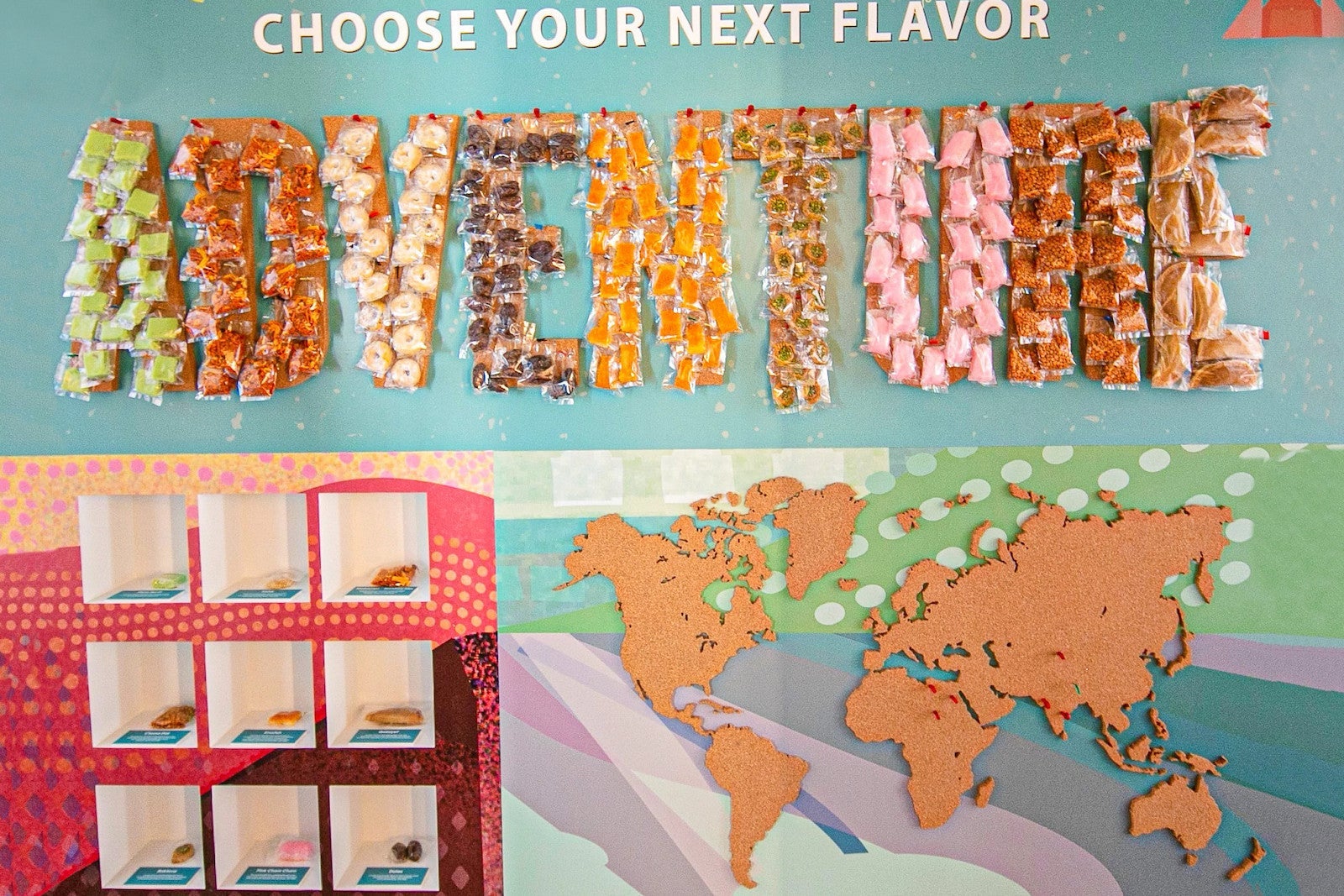 Wall with maps and snacks pinned to the word "Adventure"