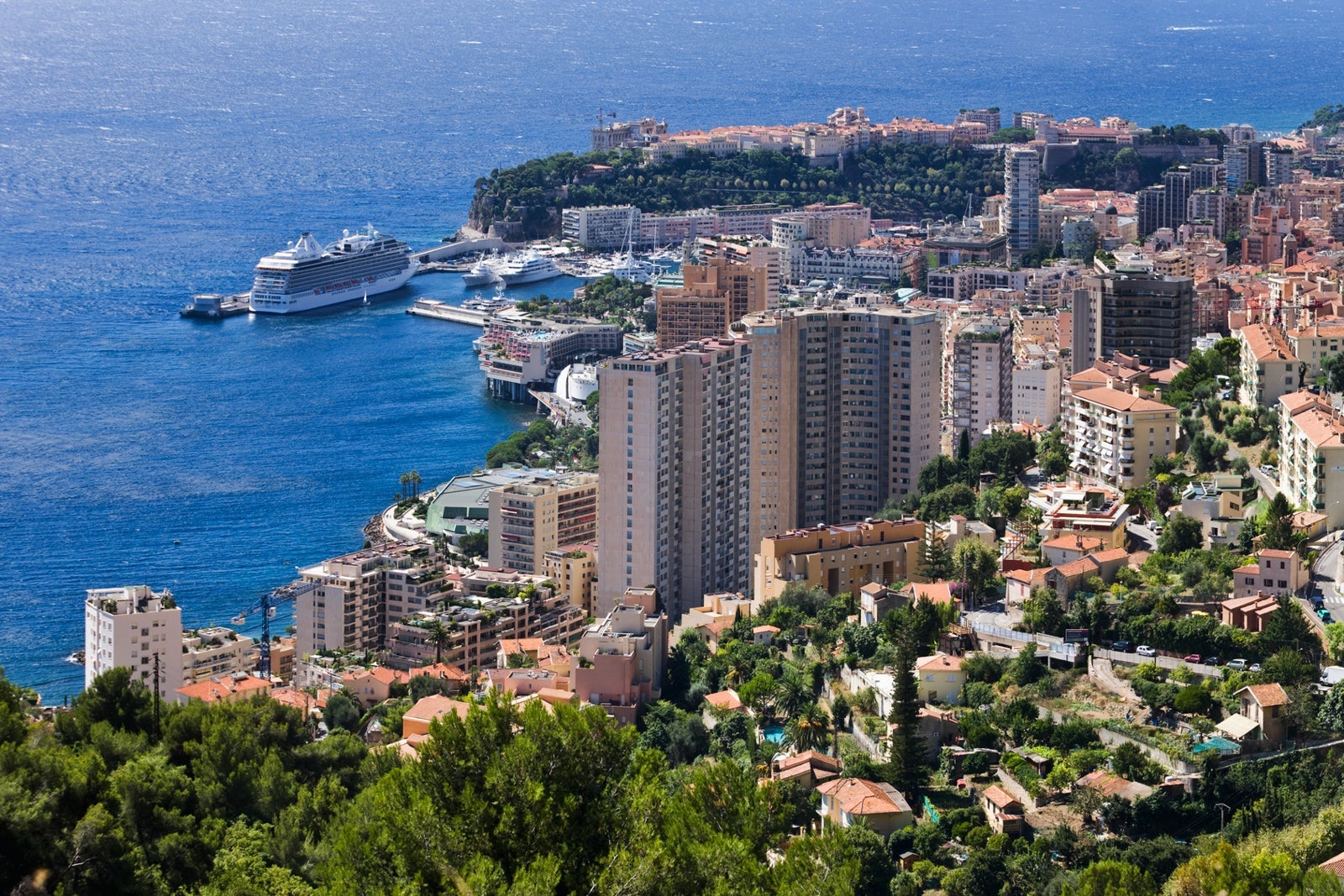 High rises of Monte Carlo with cruise ships docked at the port