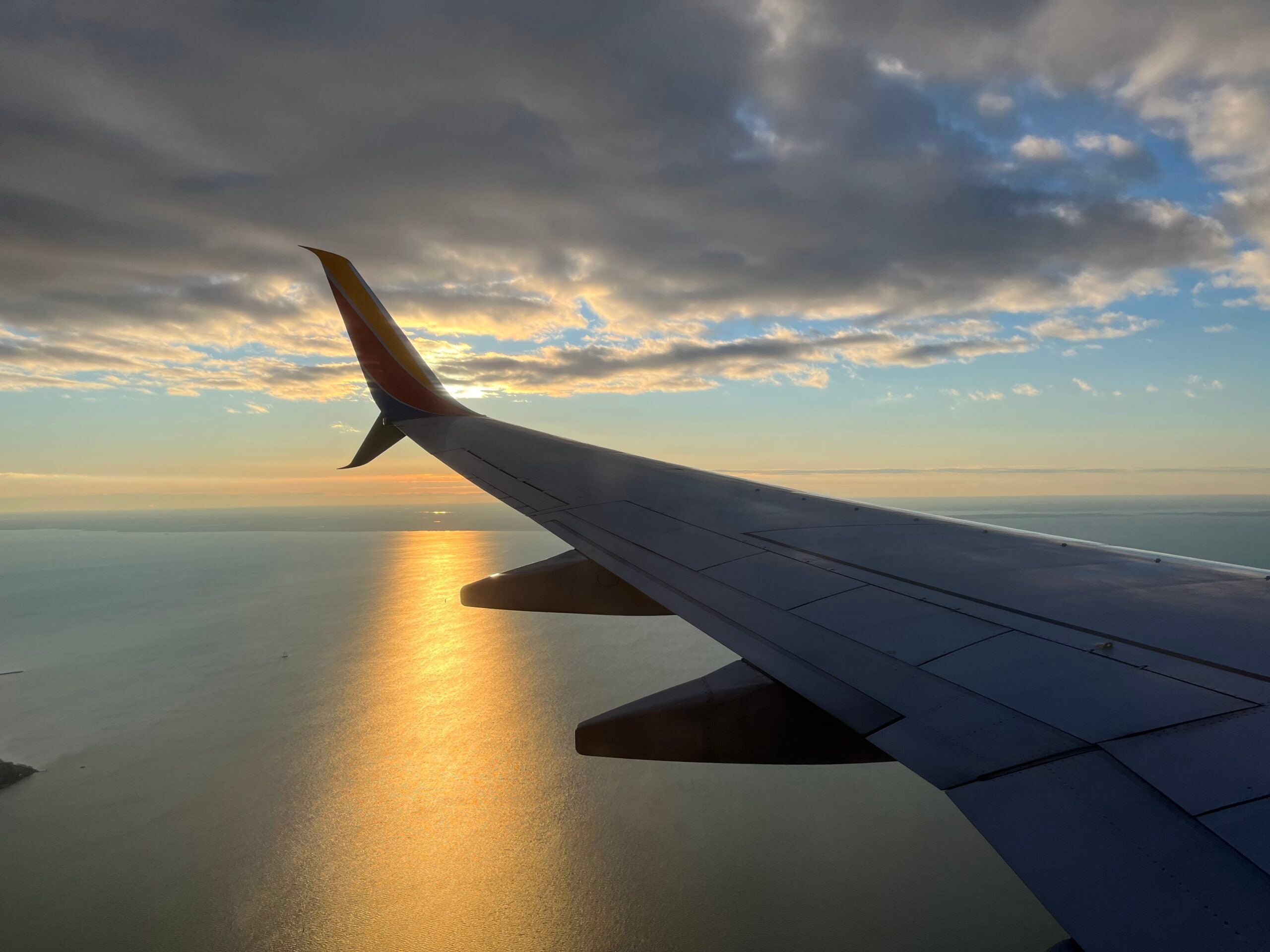 a southwest plane over the Chesapeake Bay at sunrise