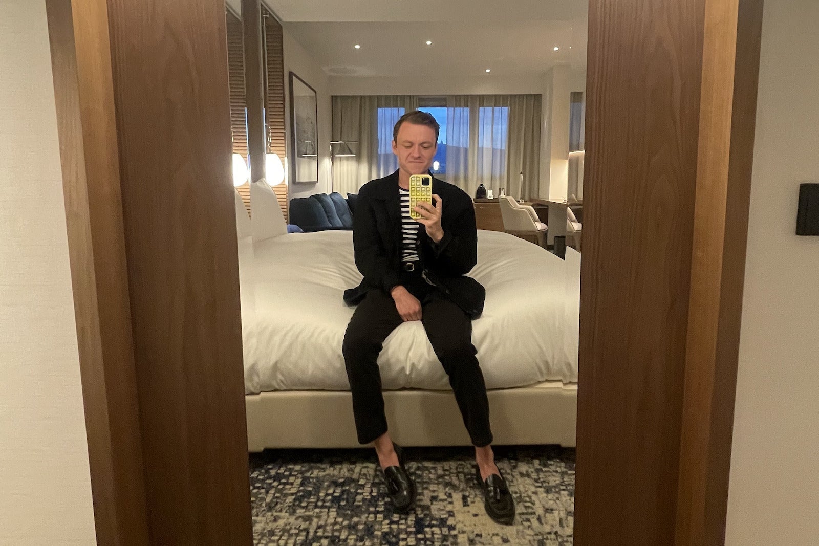 person sitting on hotel bed