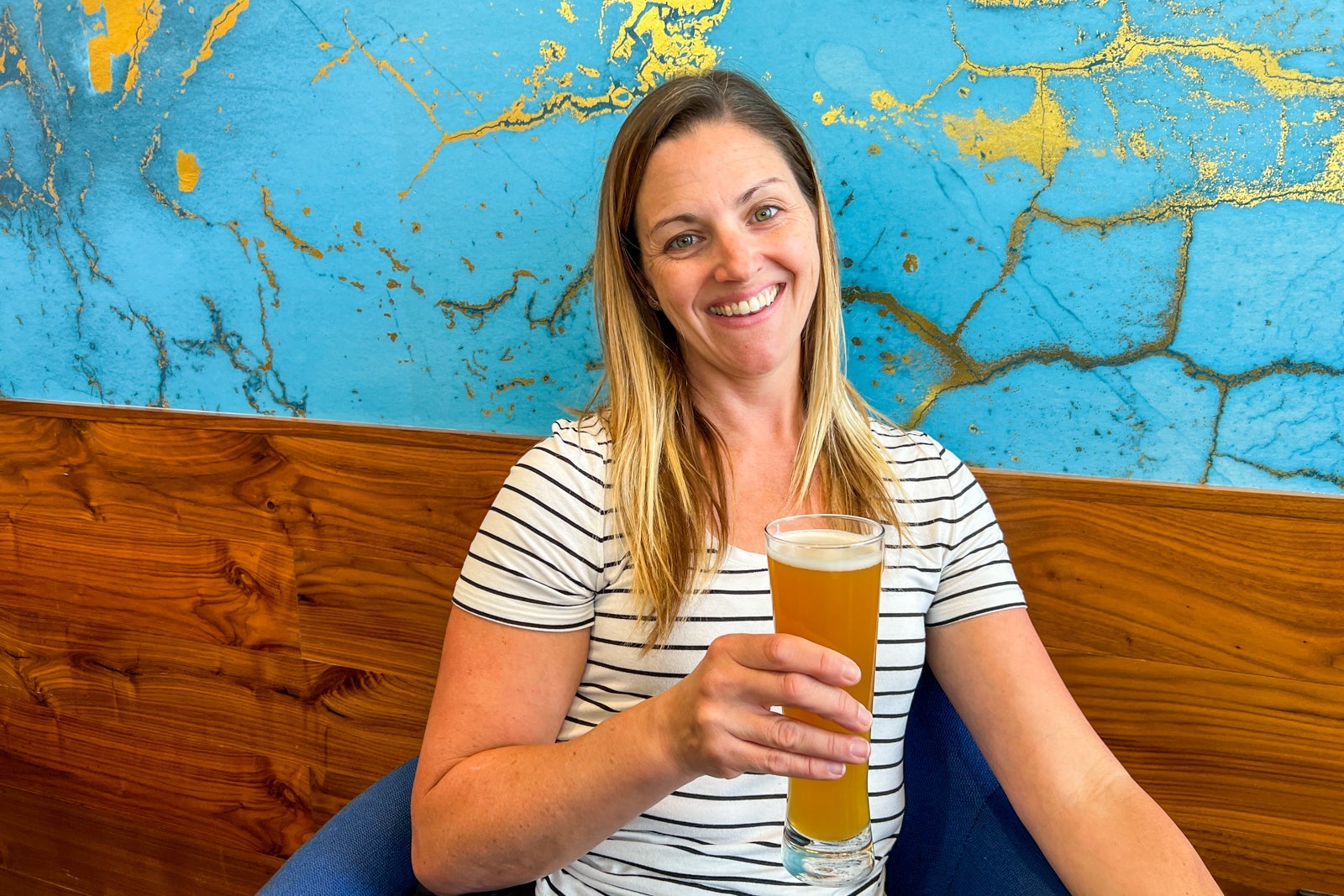 Woman holding glass of beer