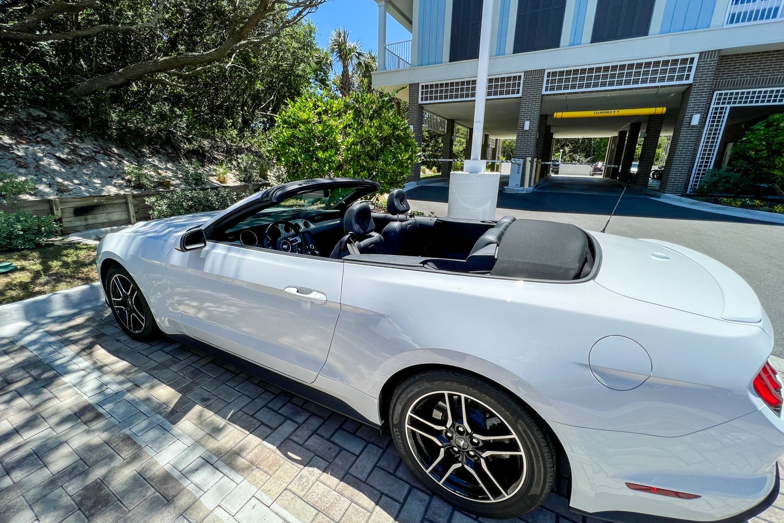 A Ford Mustang convertible rented from Hertz.
