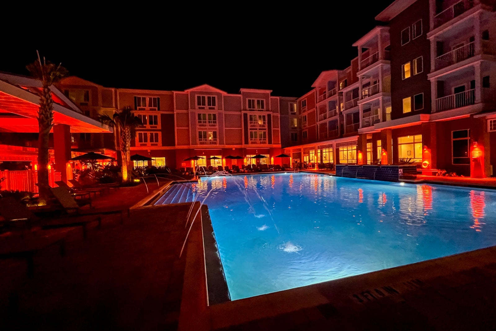 The swimming pool at the SpringHill Suites by Marriott Amelia Island at night.