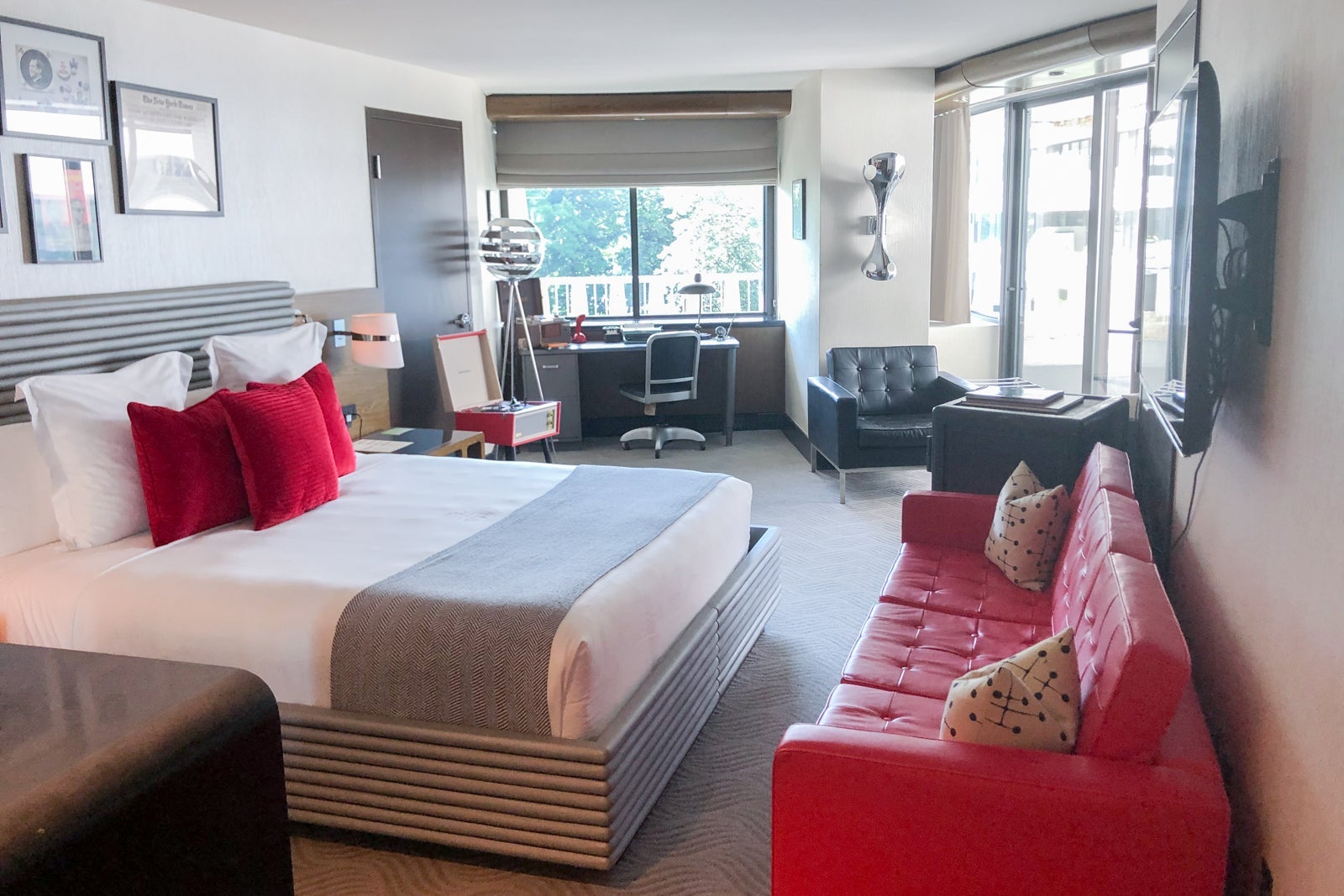 The Scandal Room features a king-size bed, an antique desk and a couple of sitting areas, all with 1970s-inspired touches.