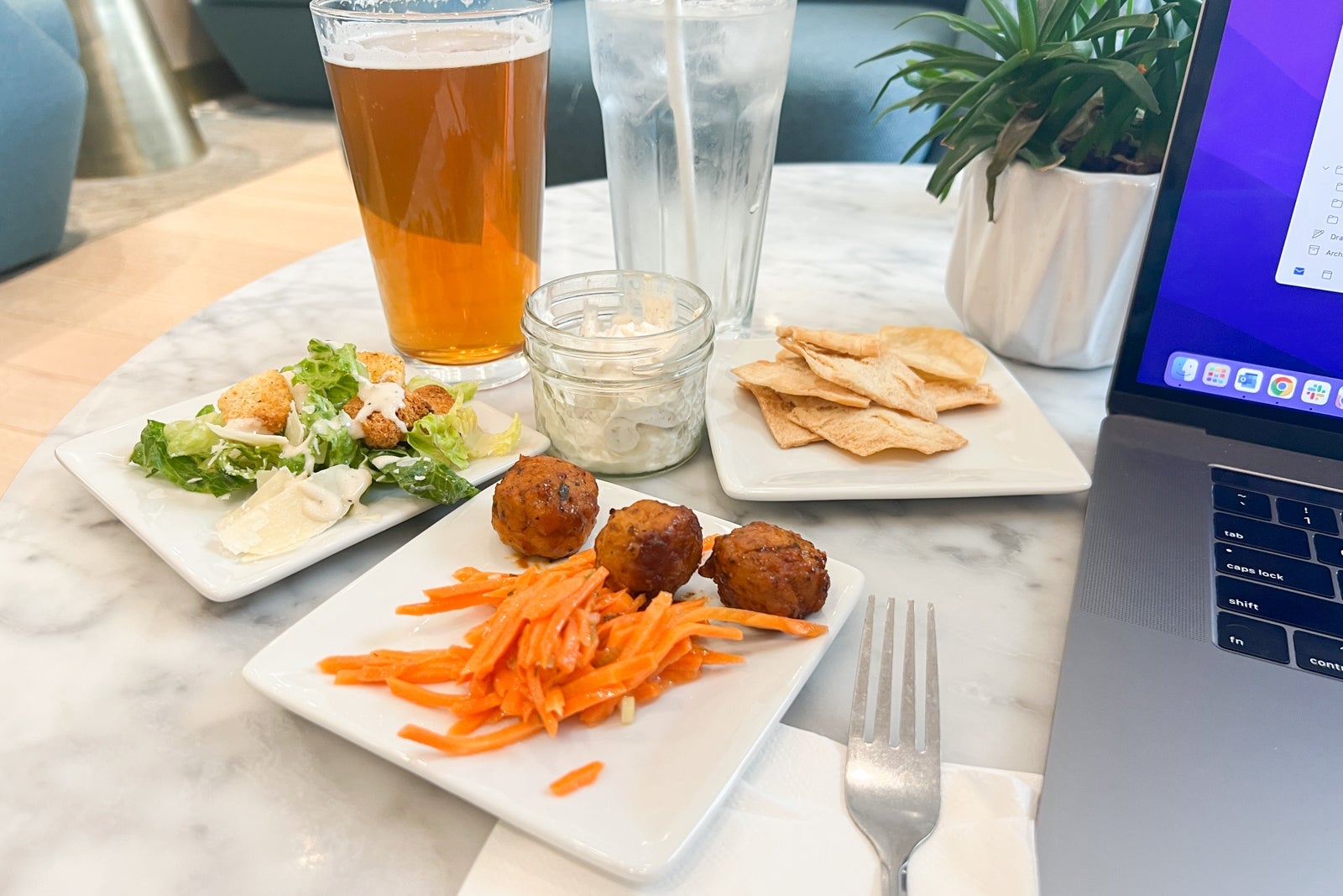Food, beer and water in airport lounge