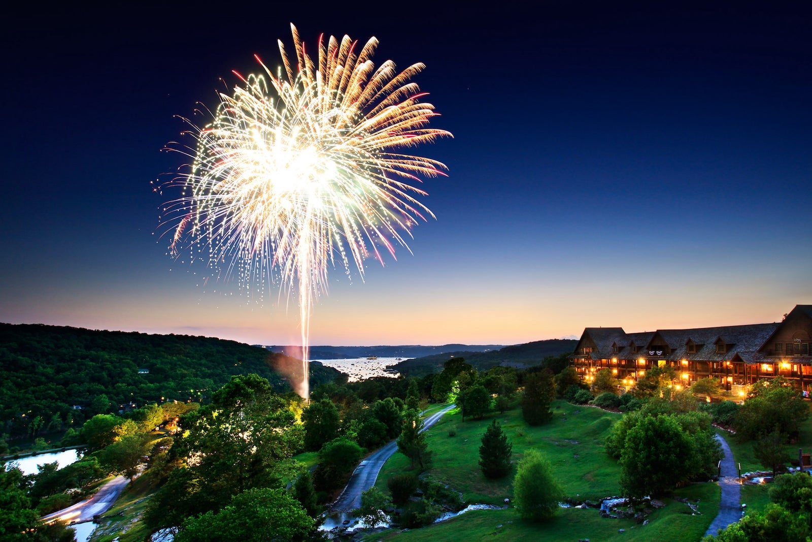 fireworks exploding over mountain resort