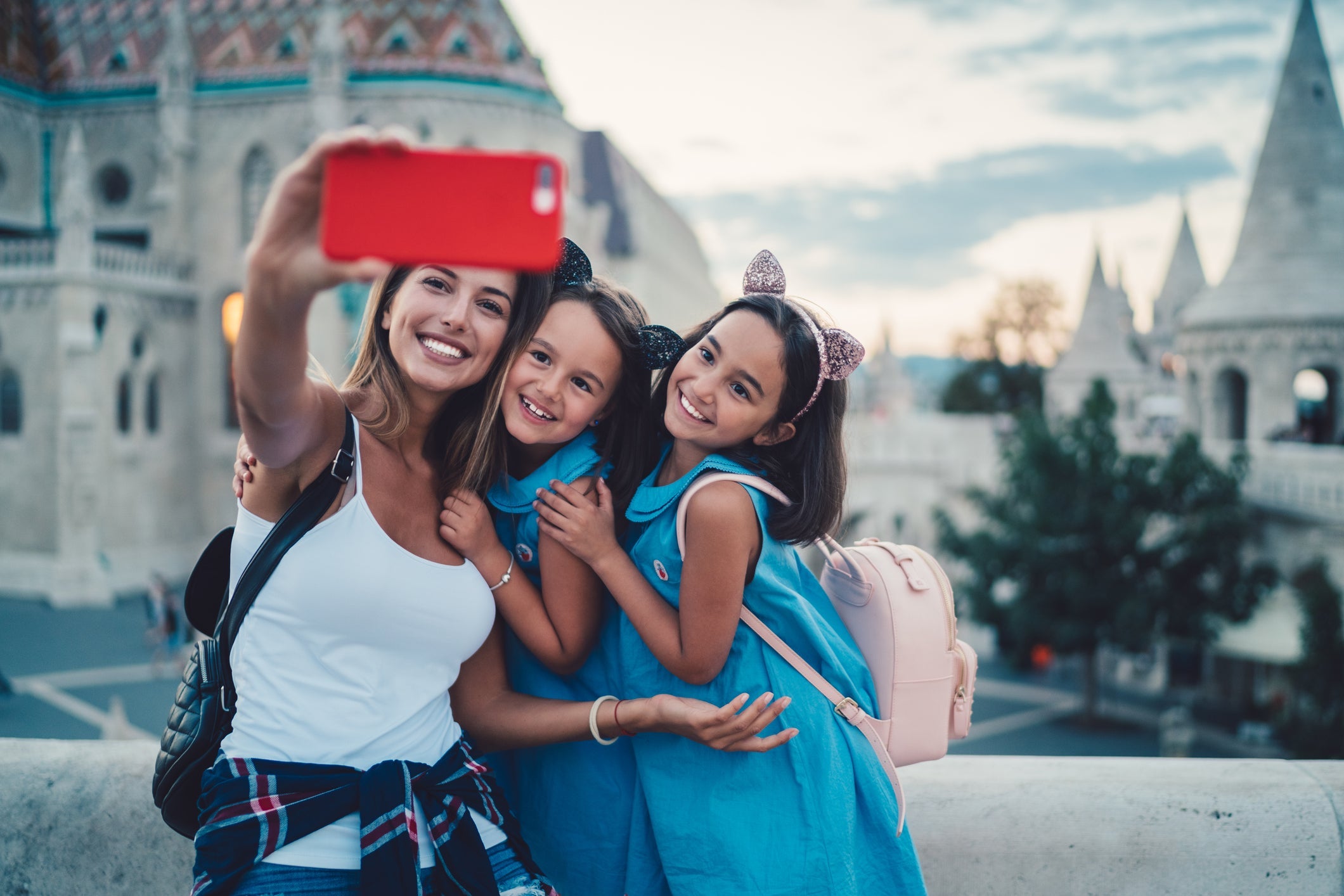 kids taking selfie with mom