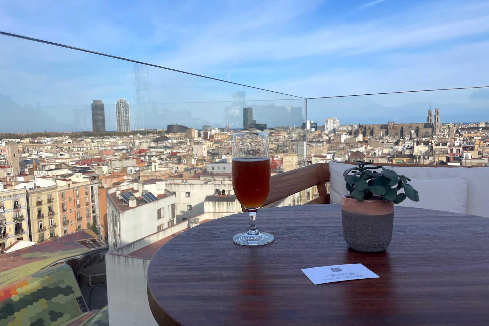 beer on table overlooking Barcelona