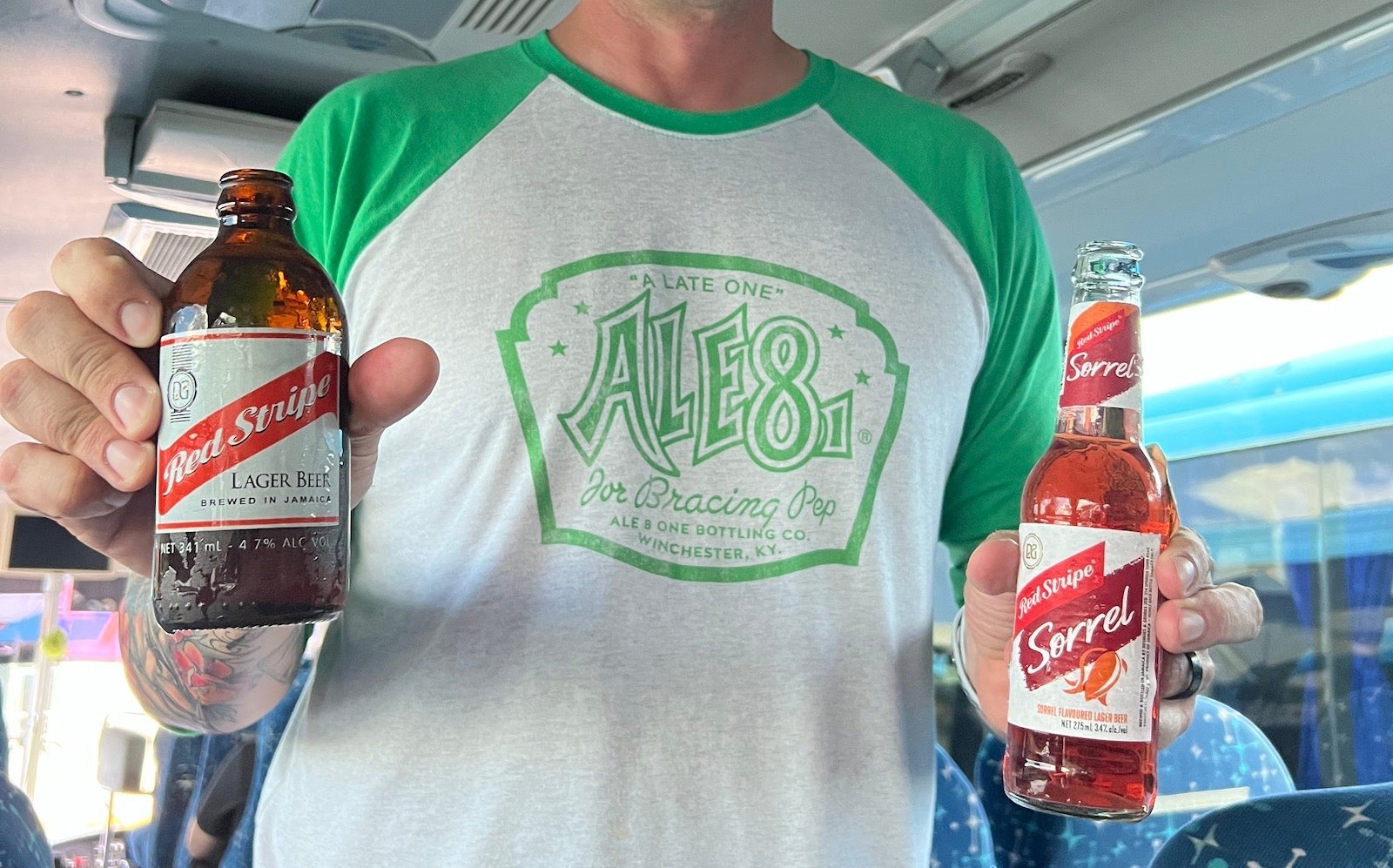 Man holding two bottles of beer