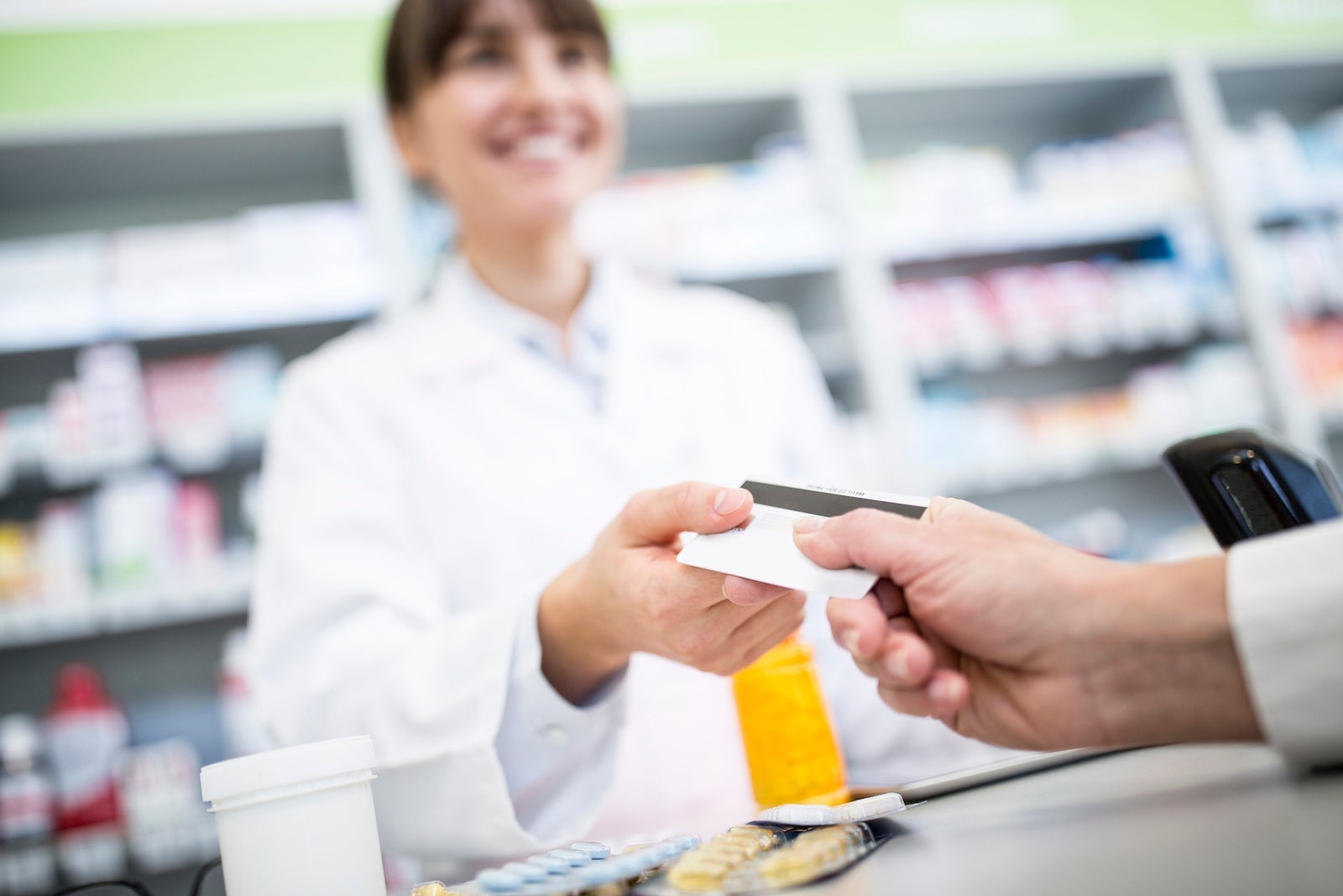 Customer paying cashless in a pharmacy