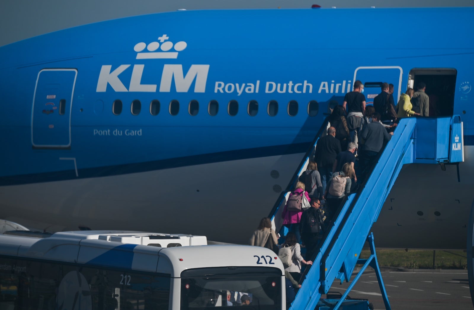 passengers board a KLM plane in Amsterdam