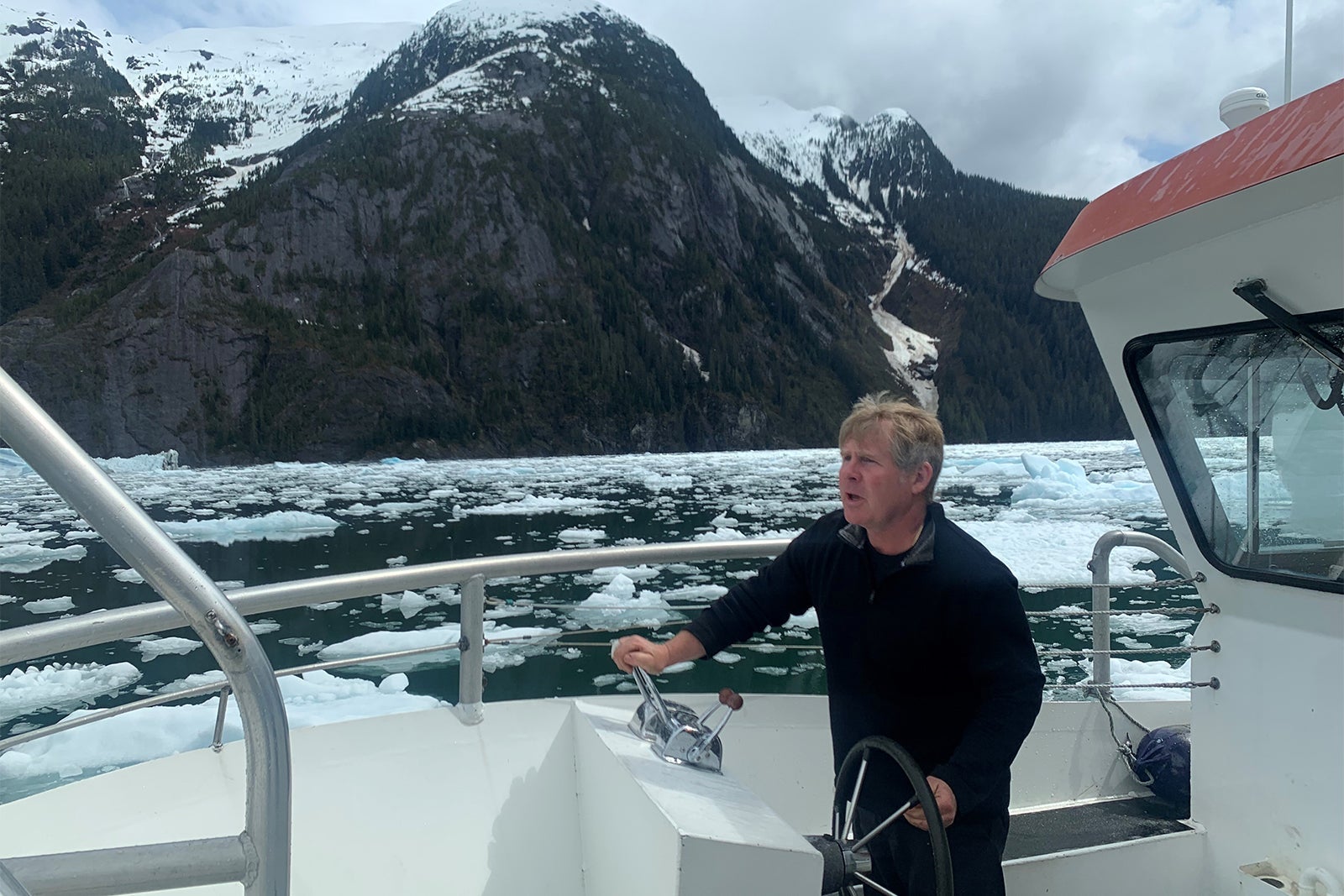 Rob Schwartz drives a boat through icy Leconte Bay, Alaska