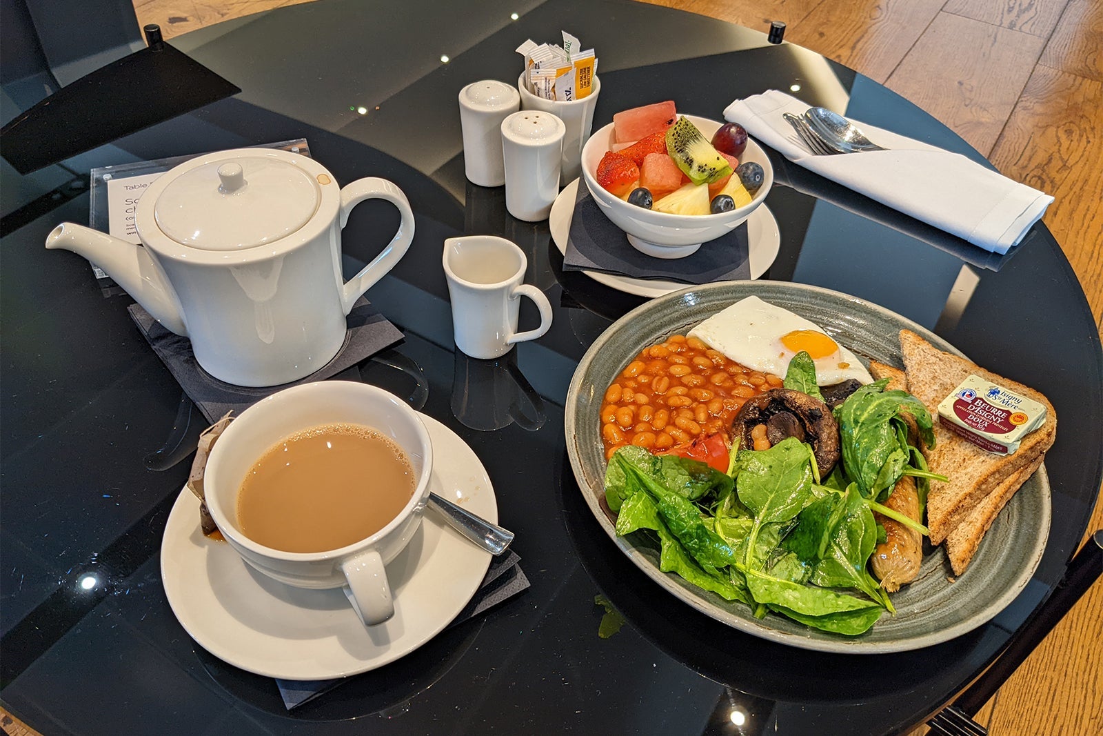 Breakfast of tea, eggs, beans and fruits at Virgin Atlantic's Upper Class lounge