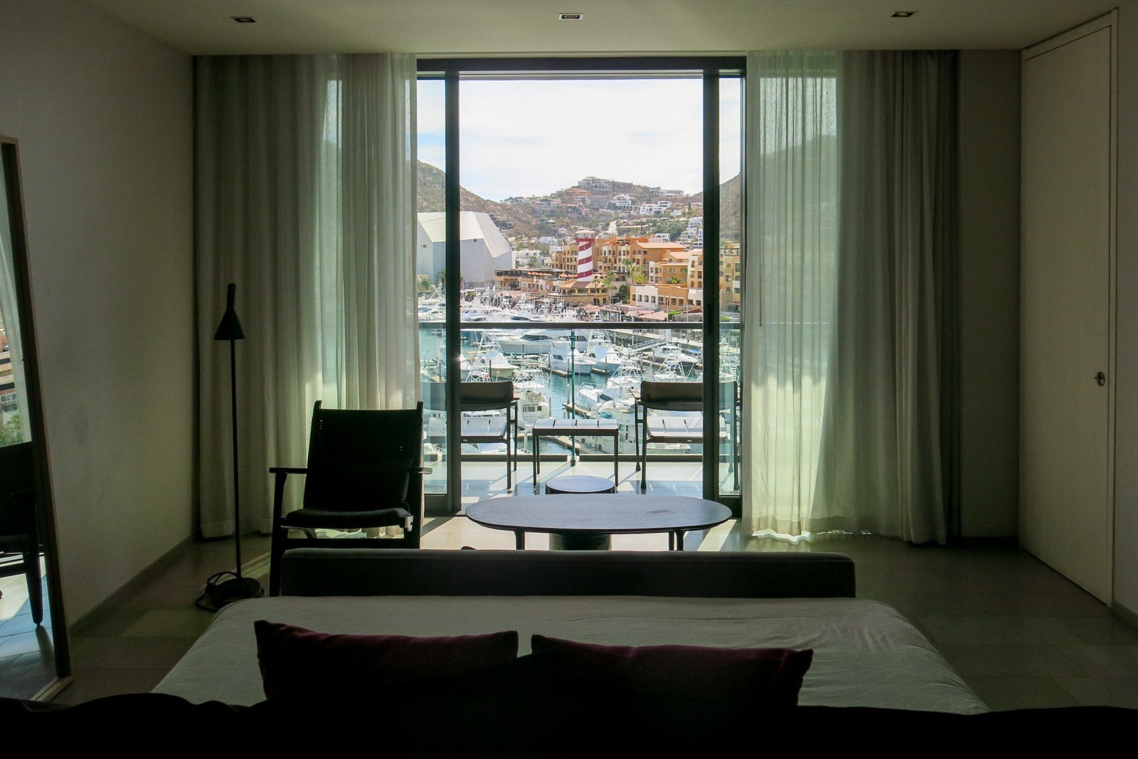 View of the balcony and marina from the bed.