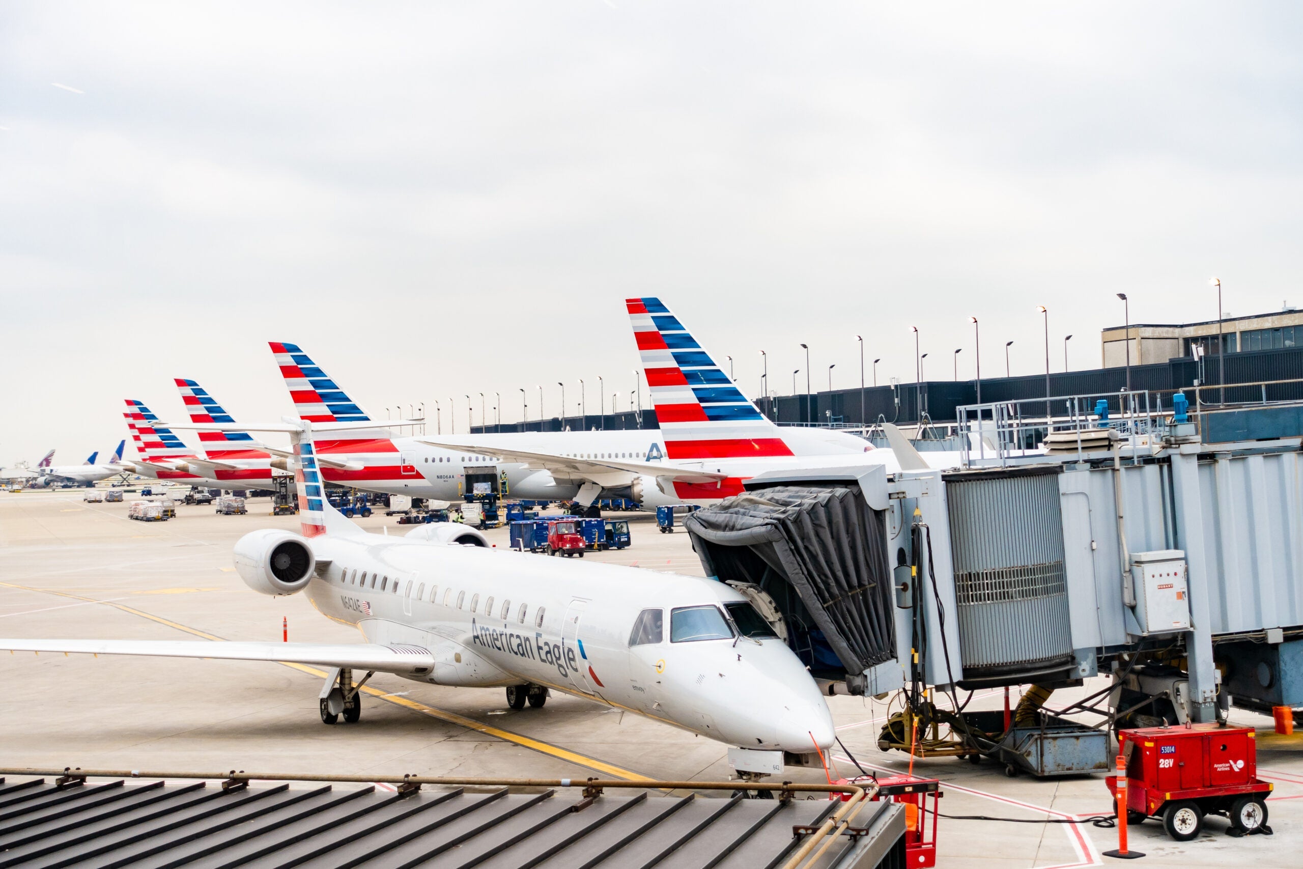 American Airlines planes finishing up for take-off at gate