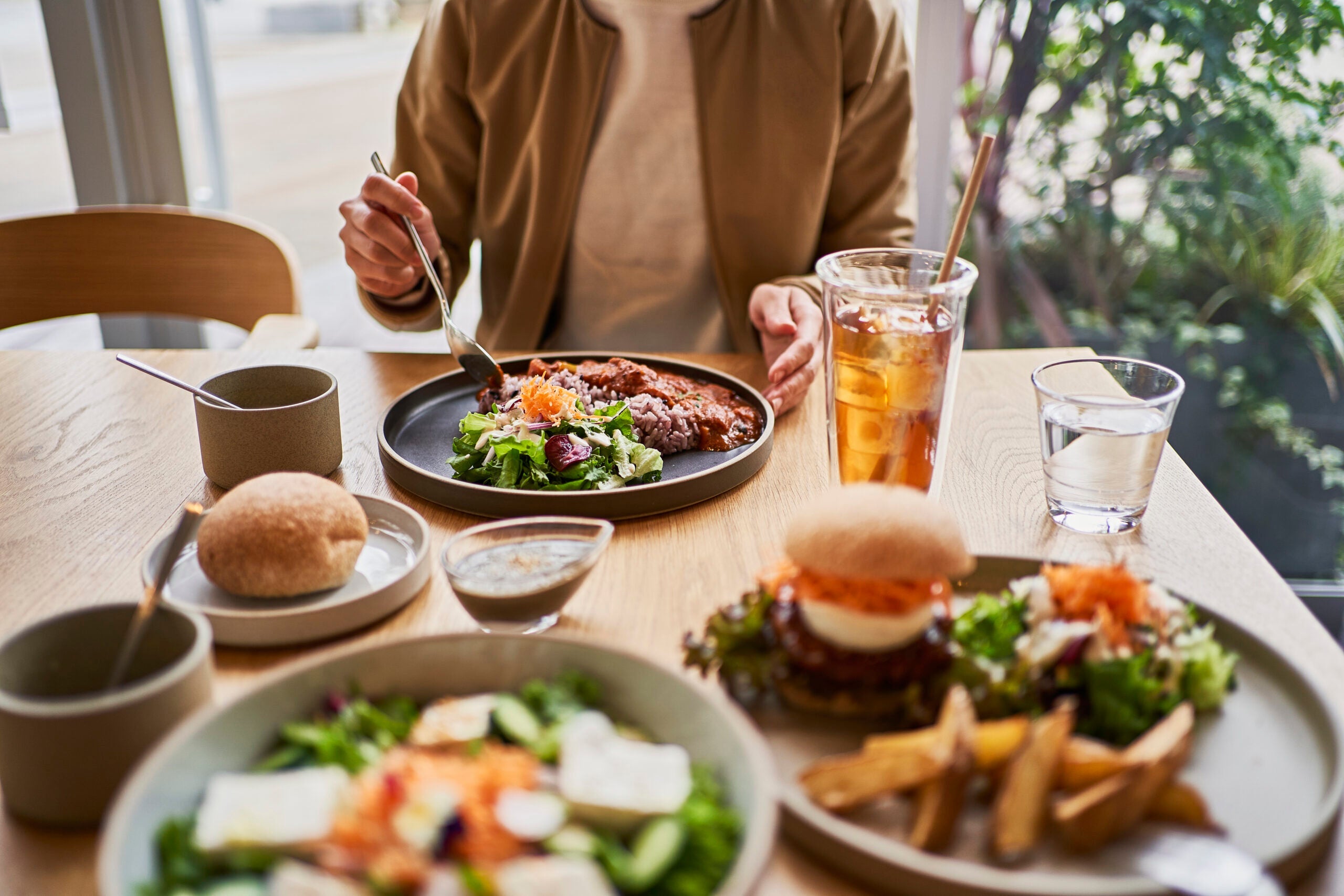 Scene at a table with a couple enjoying lunch at a vegan cafe