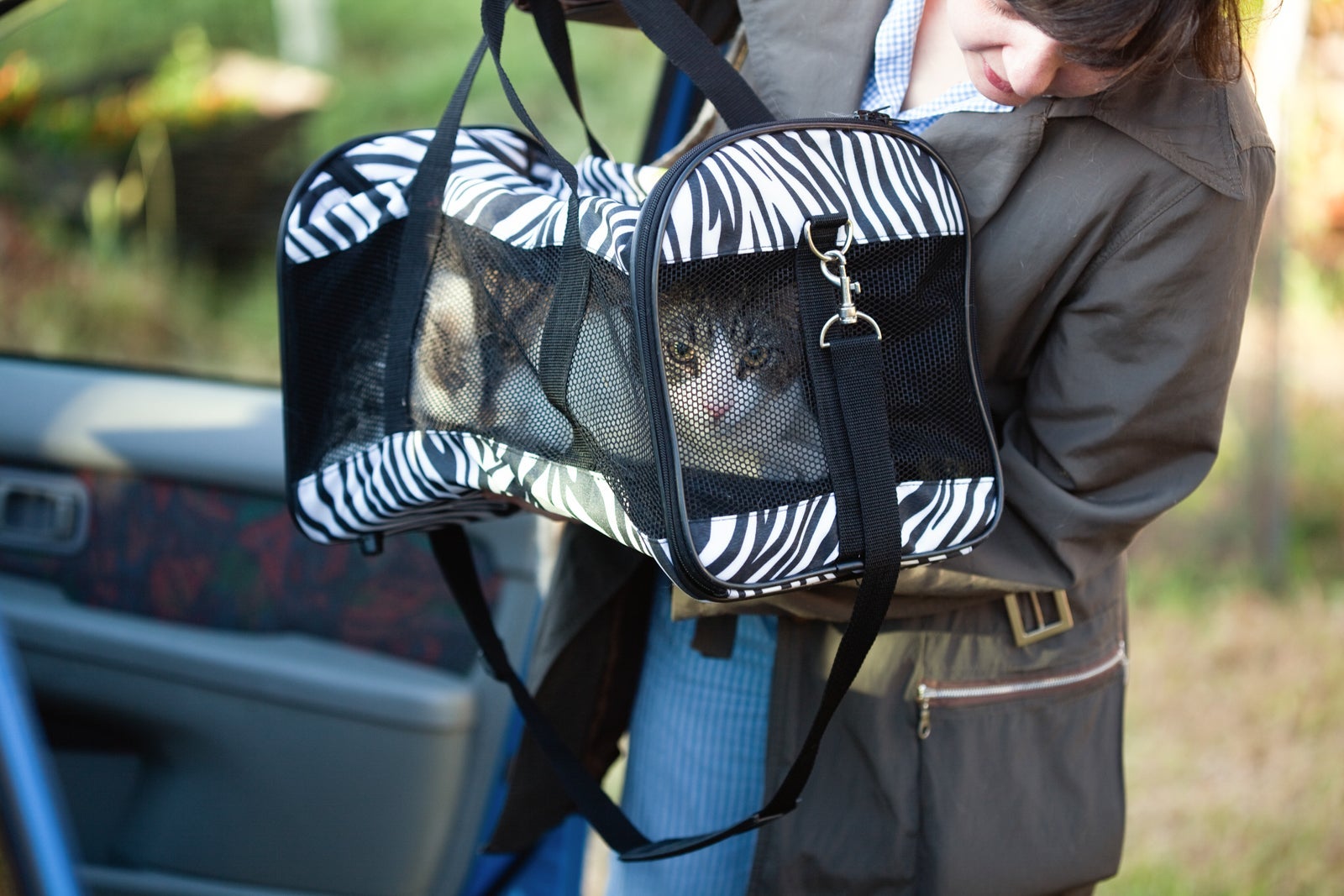 Woman with pet carrier