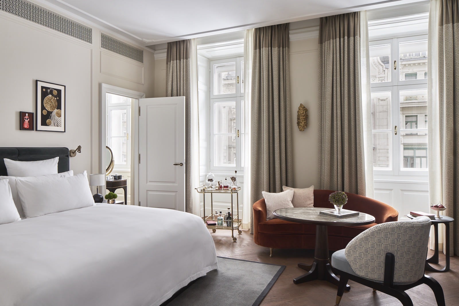 beautiful hotel room with large bed and couch