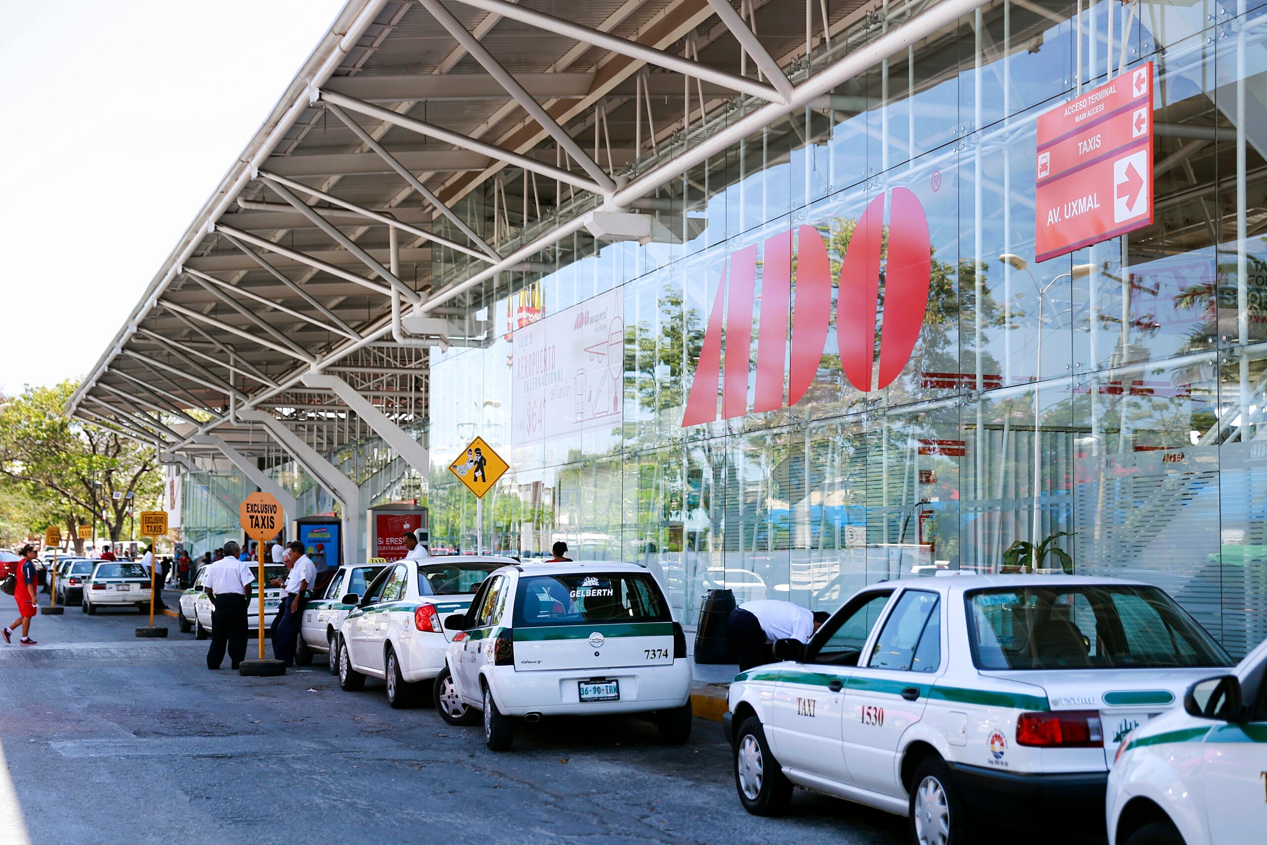 Taxis outside of a bus station in Cancun