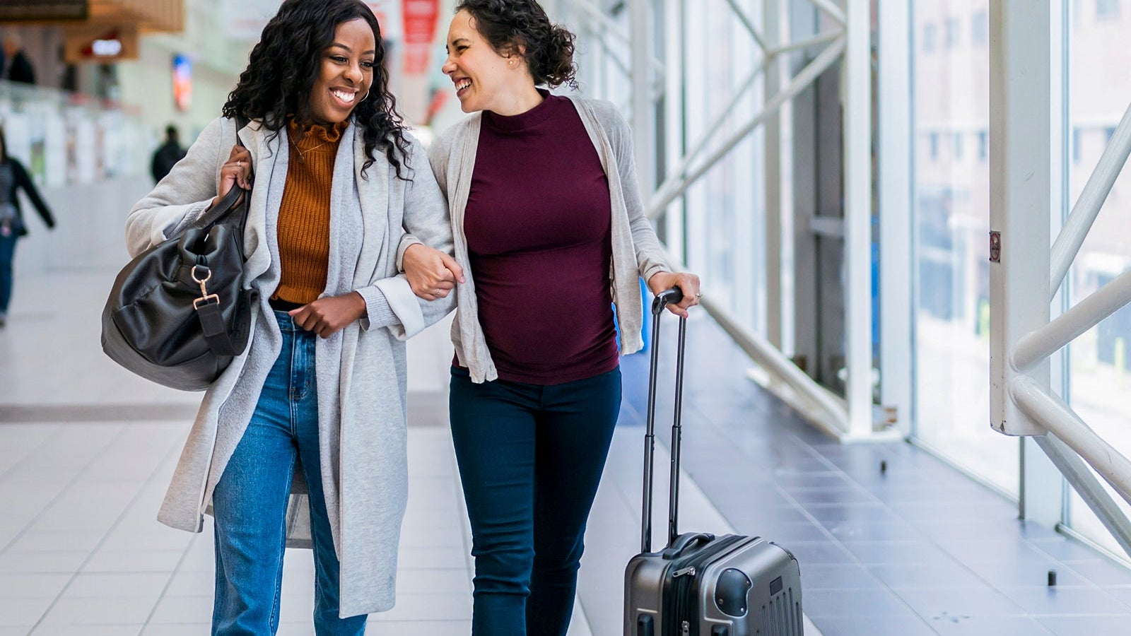 Pregnant woman traveling by plane with female partner