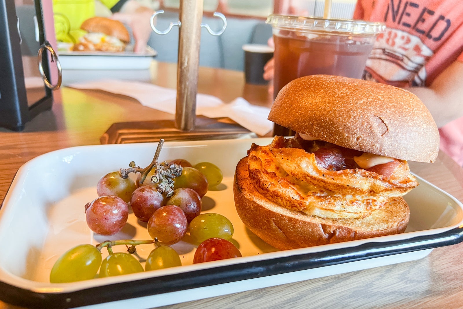 Breakfast sandwich and grapes