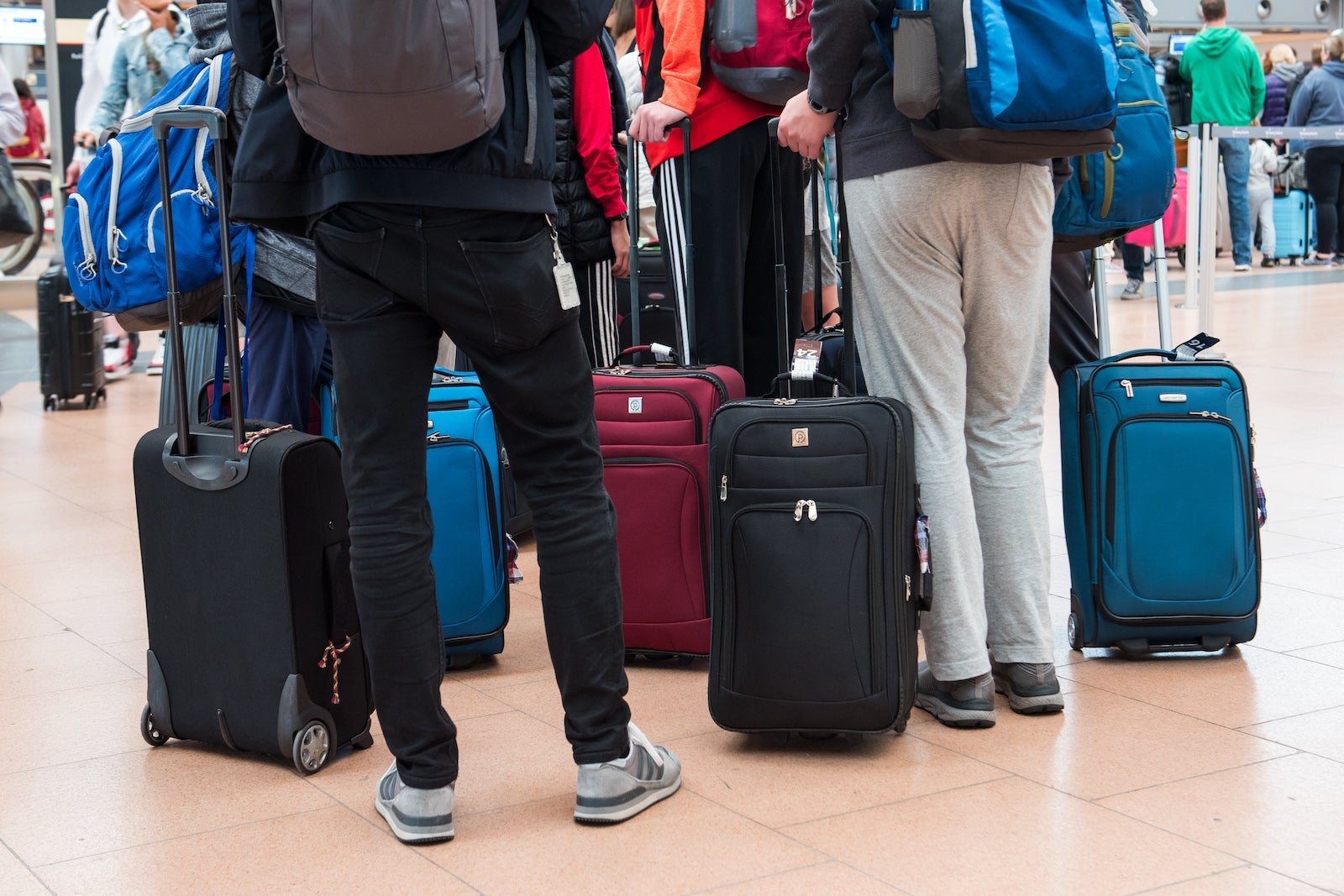 Passengers at airport with luggage