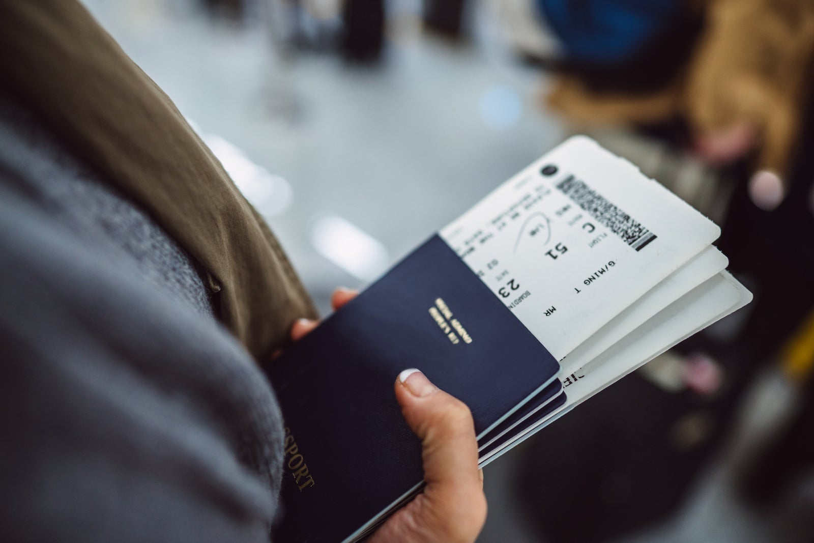 woman holds passports
