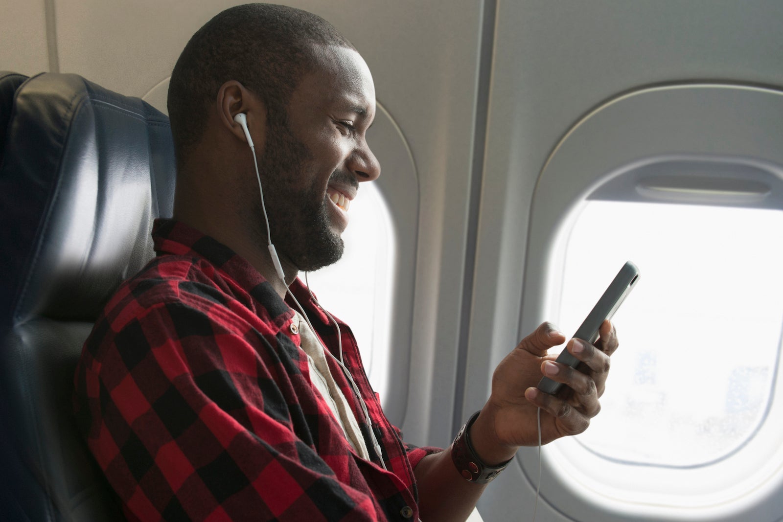Man using headphones with smart phone