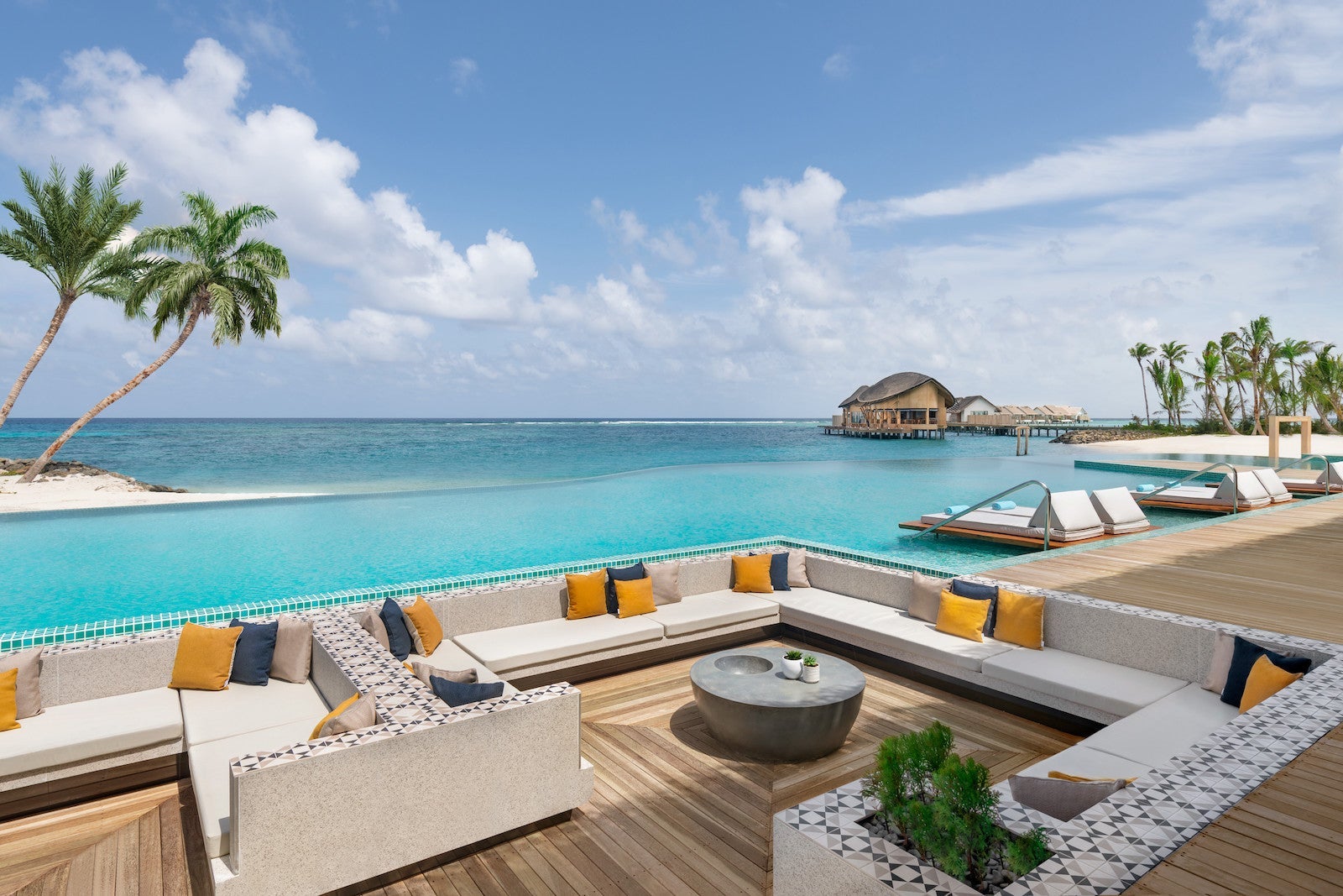 infinity pool overlooking ocean with deck