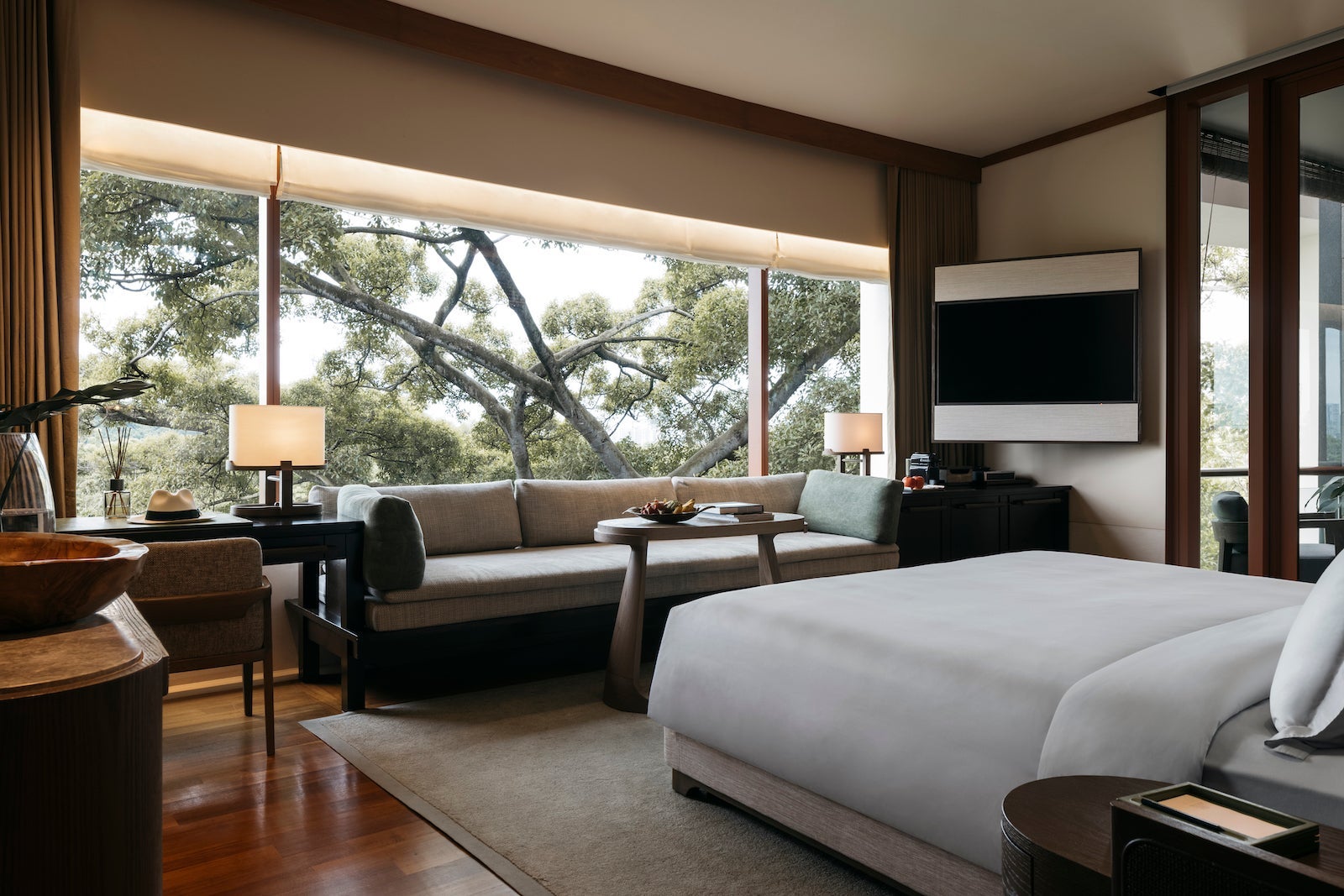 hotel room with fancy couch and bed