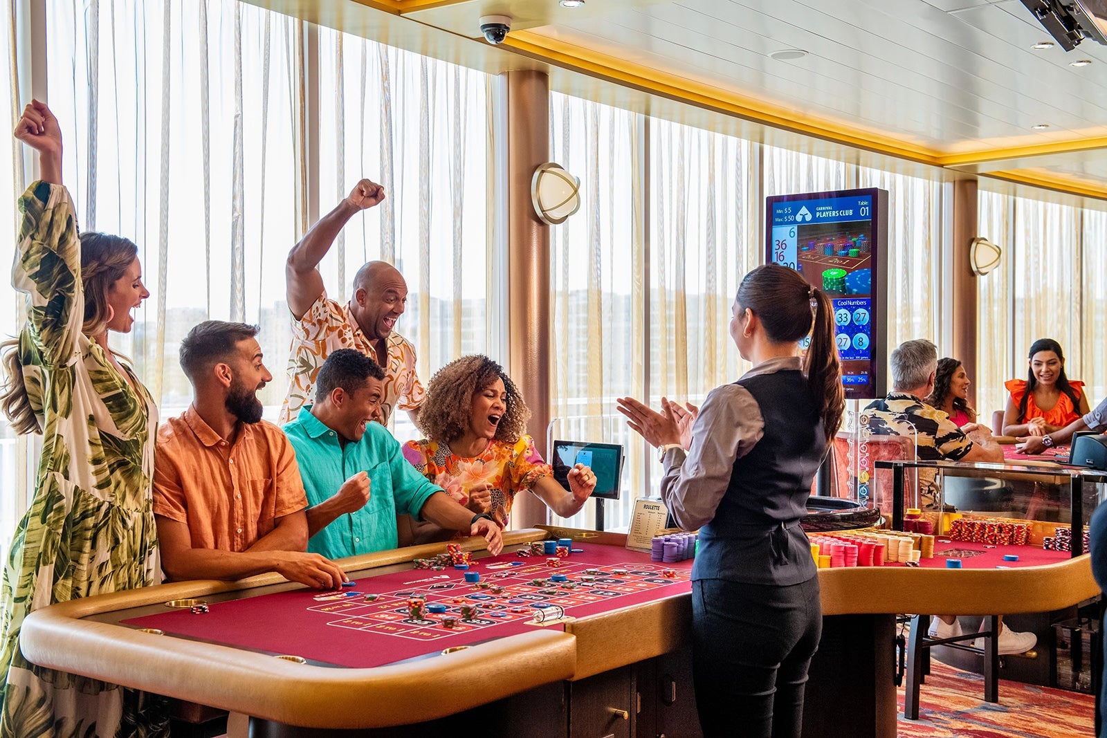 Passengers playing craps in Carnival Mardi Gras cruise ship casino