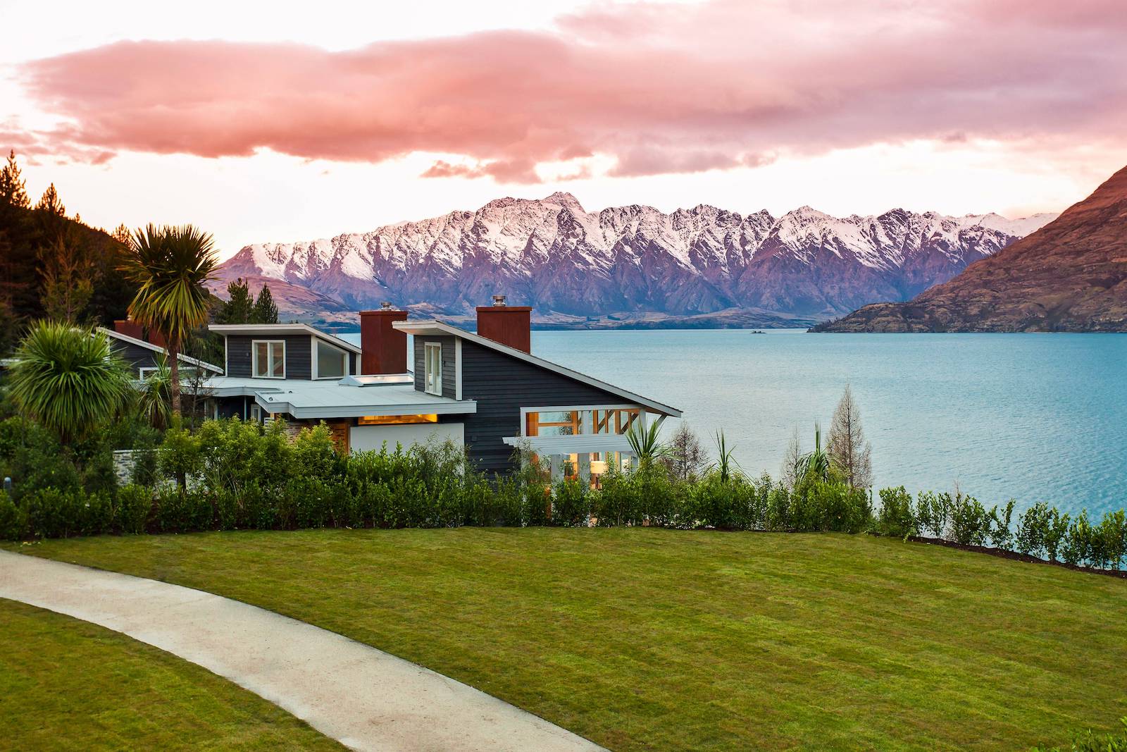 hotel with snowcapped mountains in the distance