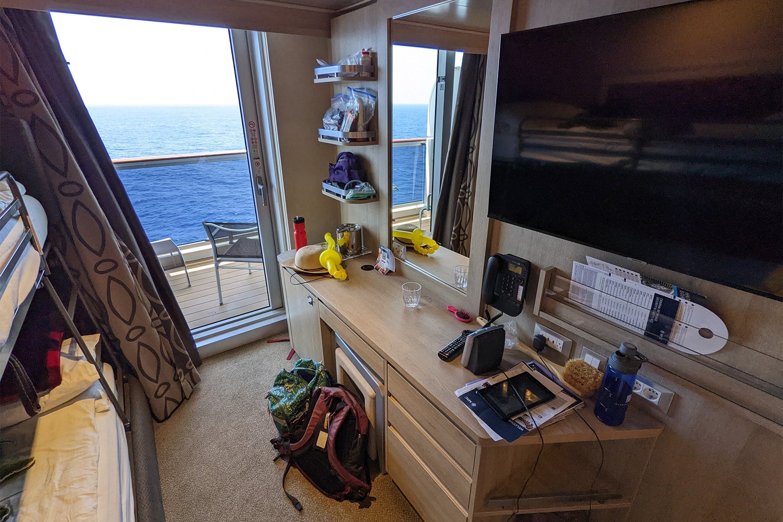 Cluttered desk in cruise ship cabin on MSC Seashore